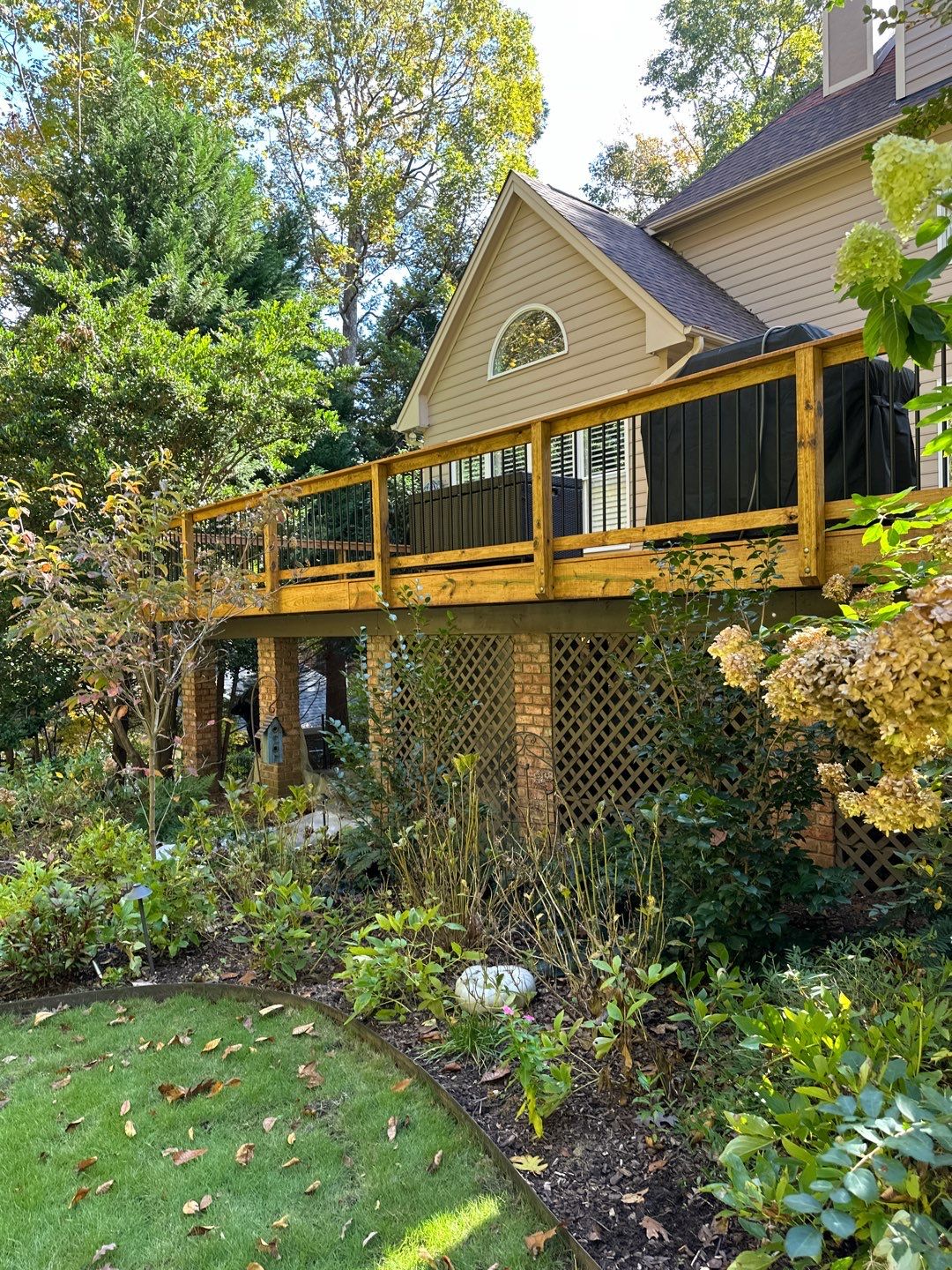 Pressure-Treated Deck Resurface with Black Aluminum Balusters in Broadway by The Remodeling Company