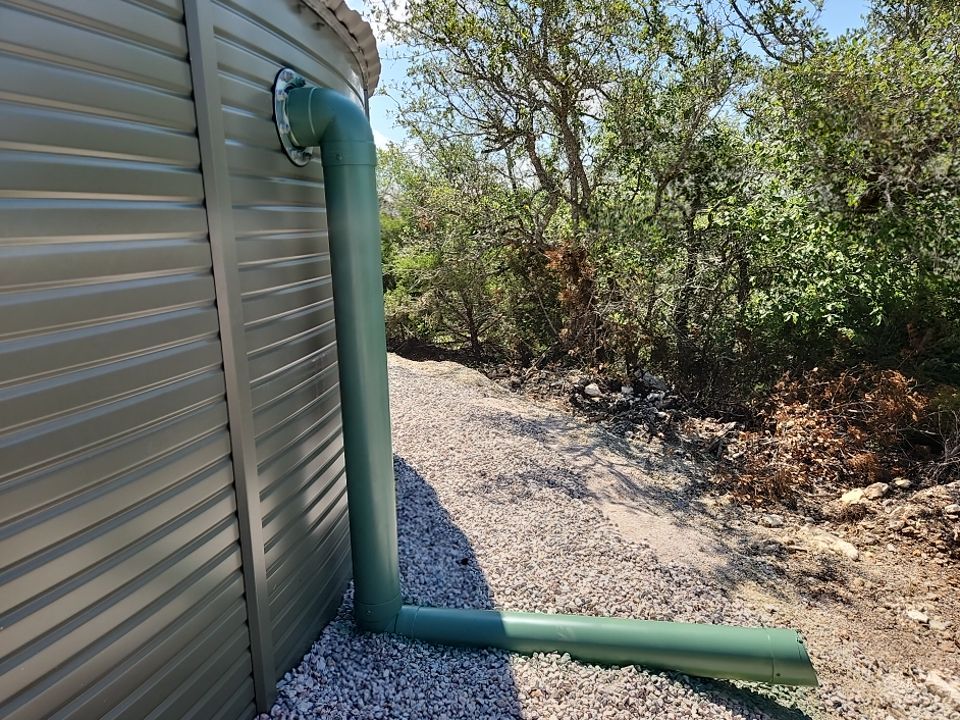 Residential Rainwater Collection System - Pioneer 40K gallon water tank in Mangrove Green by Hill Country Rain Water