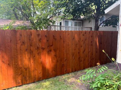 Pecan Cedar Privacy Fence Installation with Scalloped Top in Cedar Falls