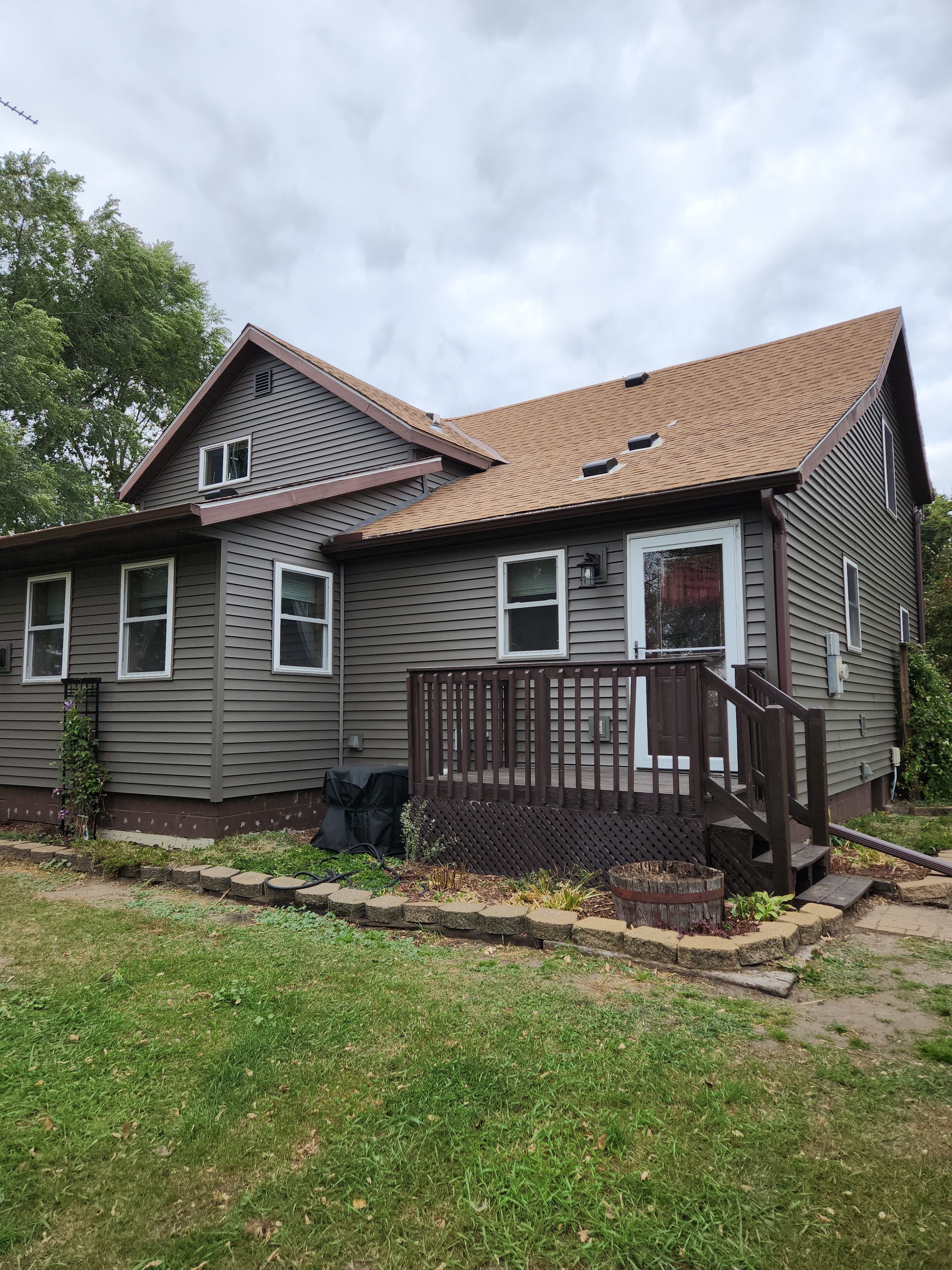 Royal Granite Siding Replacement & Brown Seamless Gutters by Next Level Seamless Gutters / Exteriors Inc.