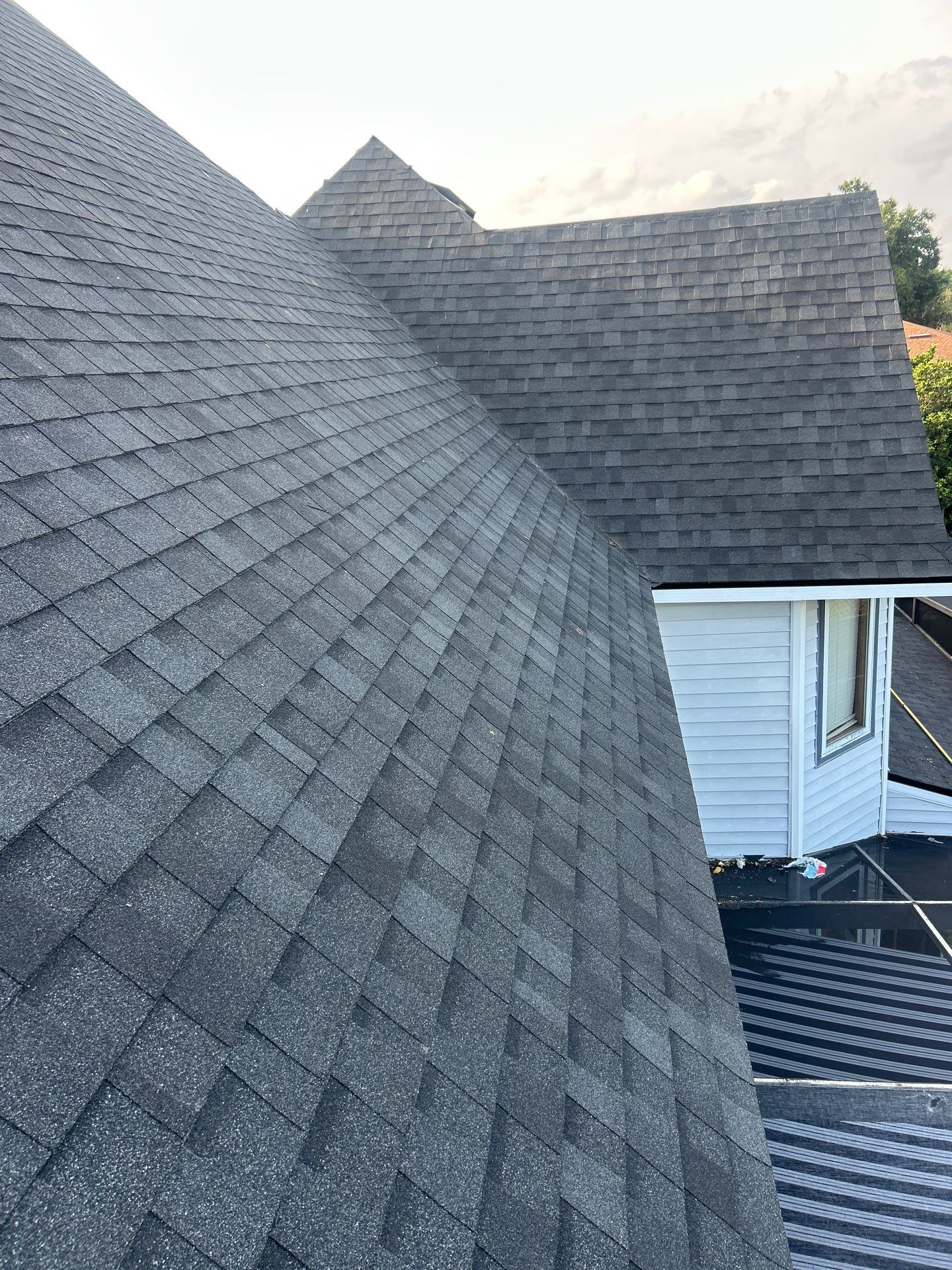 Residential Roofing Installation with Black Shadow Shingles in Clermont by Pinnacle Roofing Group