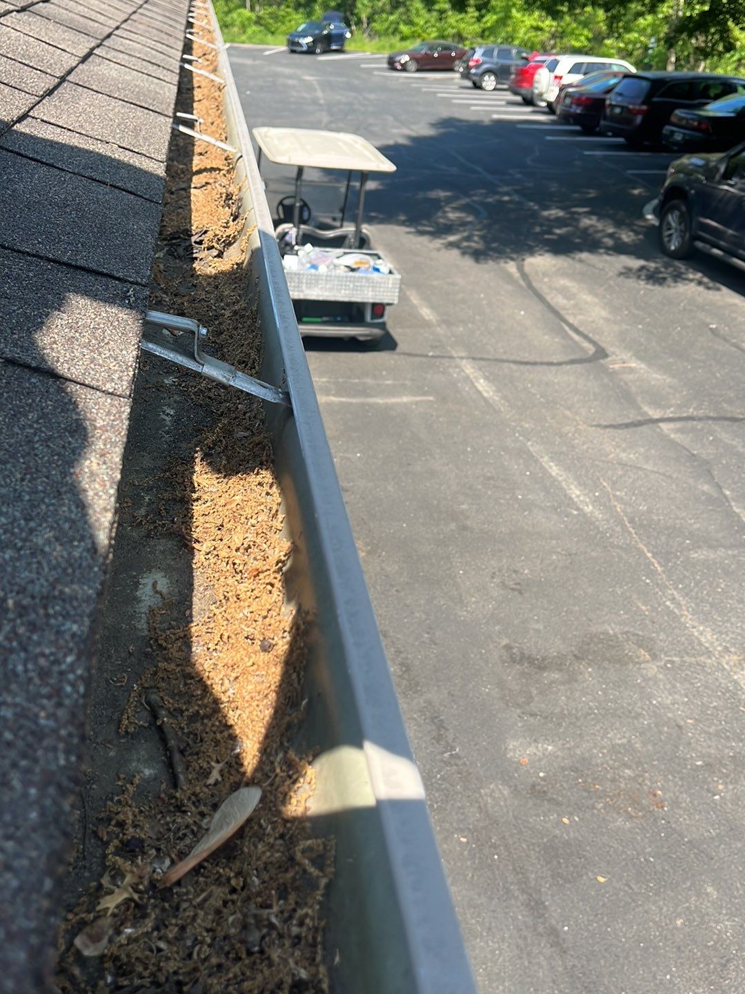 Commercial gutter cleaning Pittsburgh, PA before photo with filled gutters