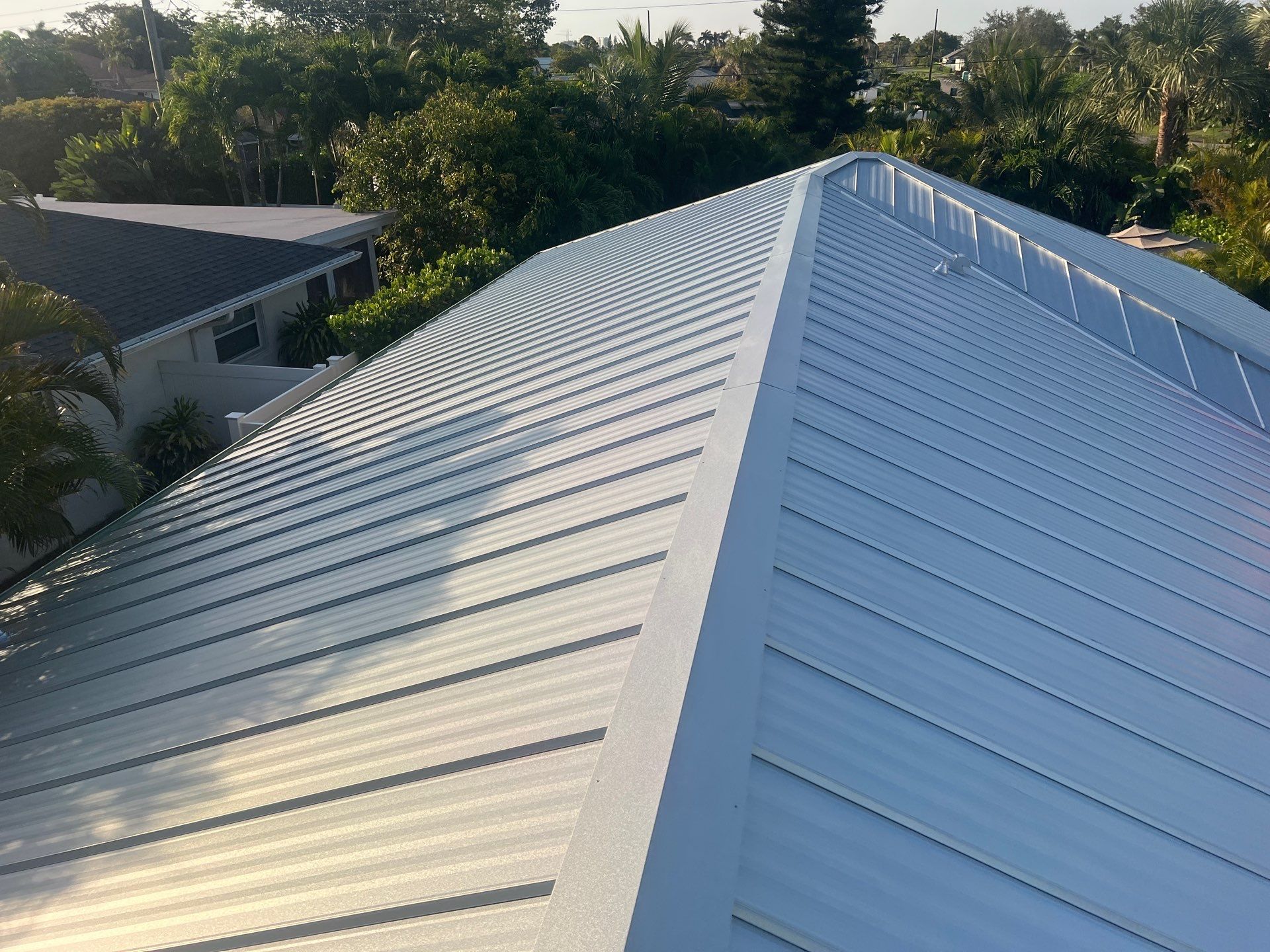 Residential Roofing Installation using Galvalume Standing Seam by Durabilis Roofing INC