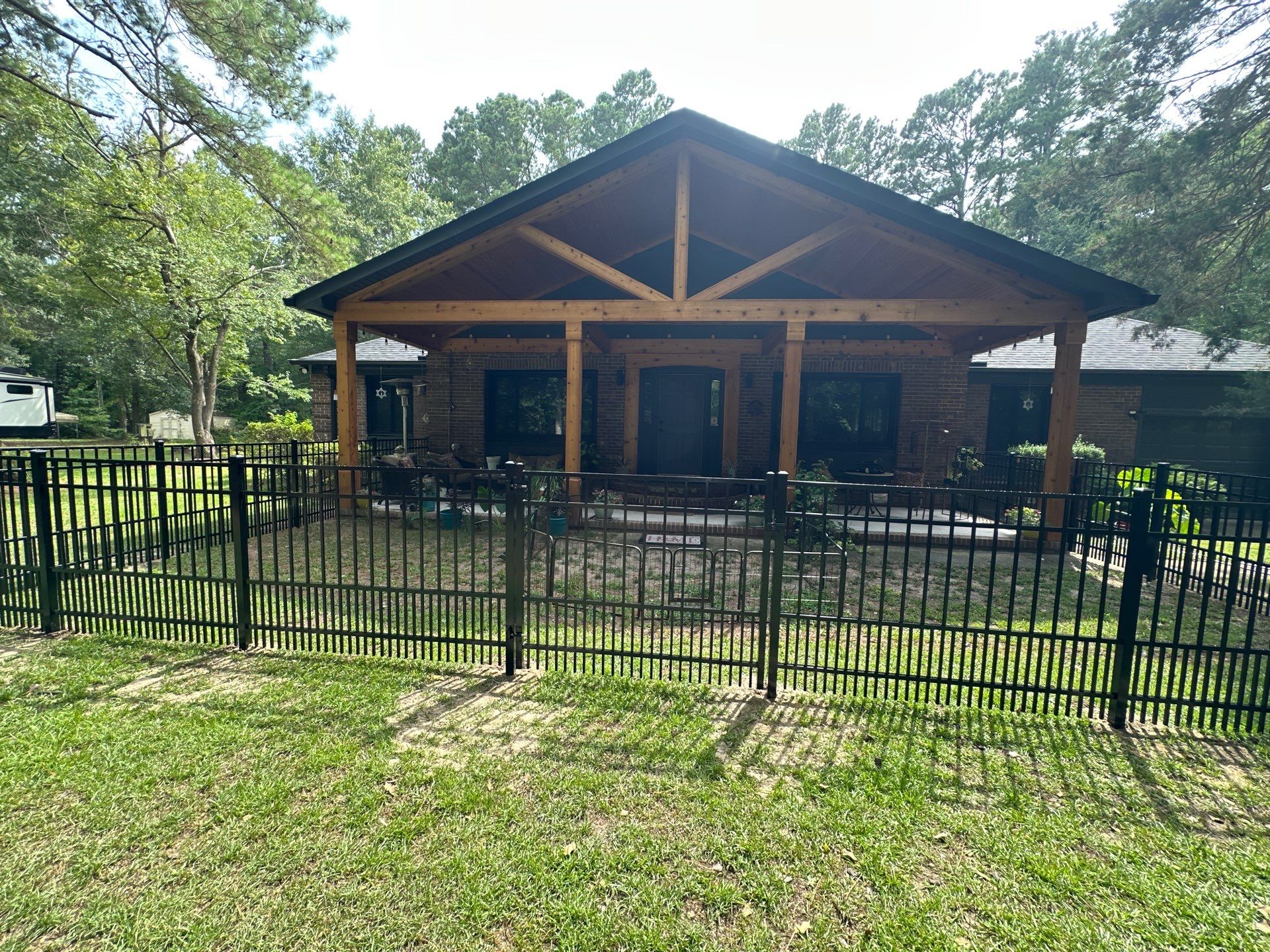 Black Vinyl Privacy Fence with Puppy Picket Aluminum Installation in Roseboro by Superior Fence and Rail