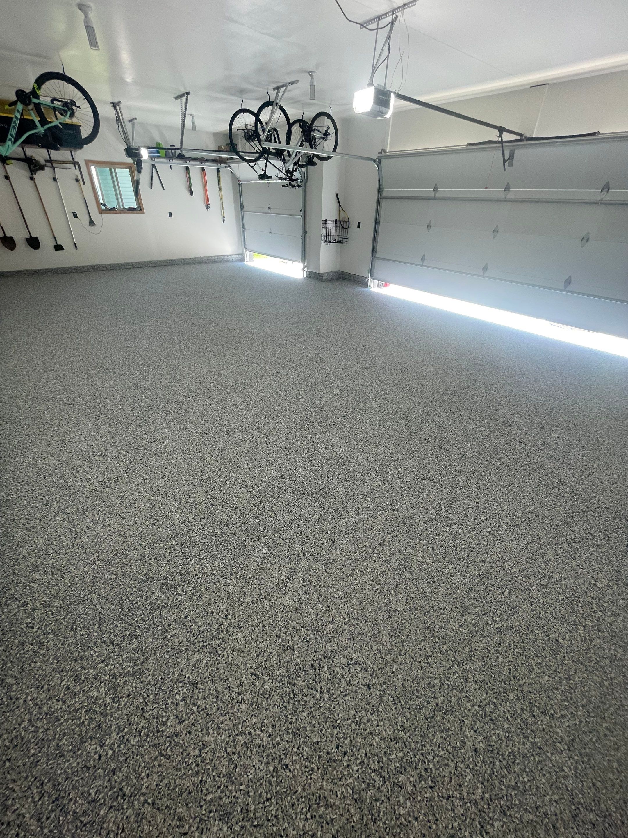 Tidal Wave Flake Garage Floor Installation in Sioux Falls by Select Painting, Coatings & Garage Cabinets