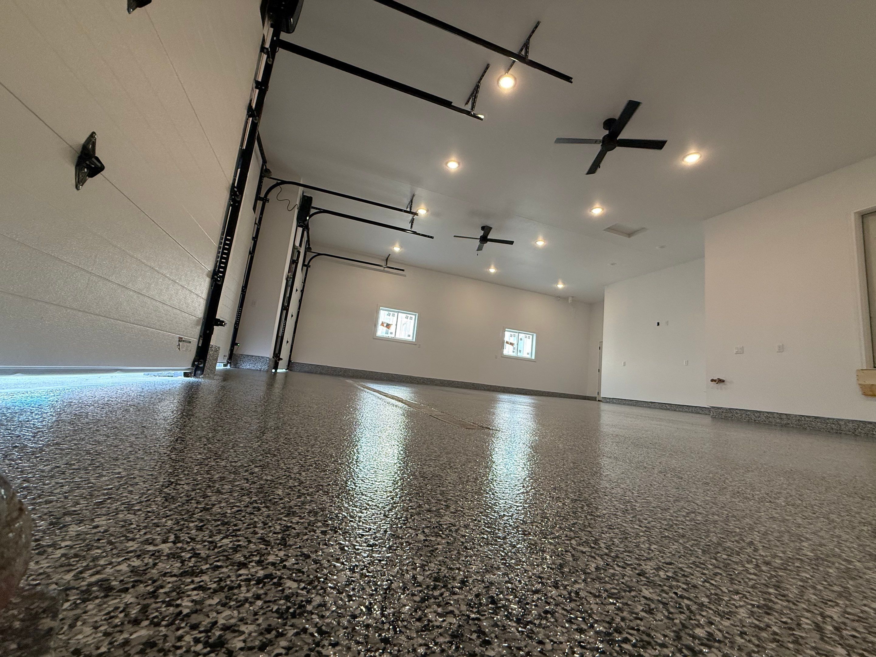 Multi-Car Garage Epoxy Floor Coating and Concrete Finishing in Sioux Falls by Select Painting, Coatings & Garage Cabinets
