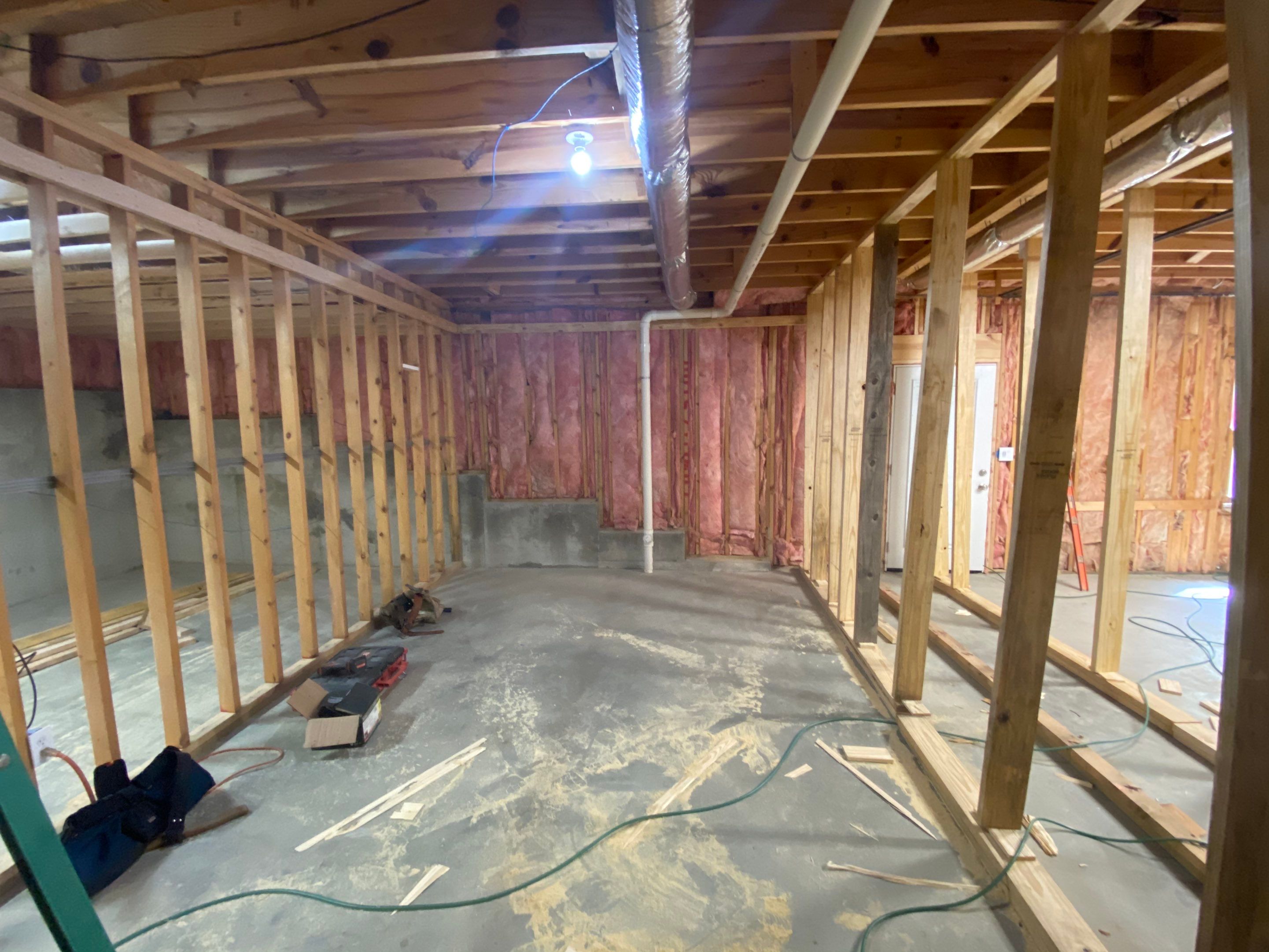 Acworth Basement Transformation With Wet Bar and Stone Fireplace by Swift Home Renovations