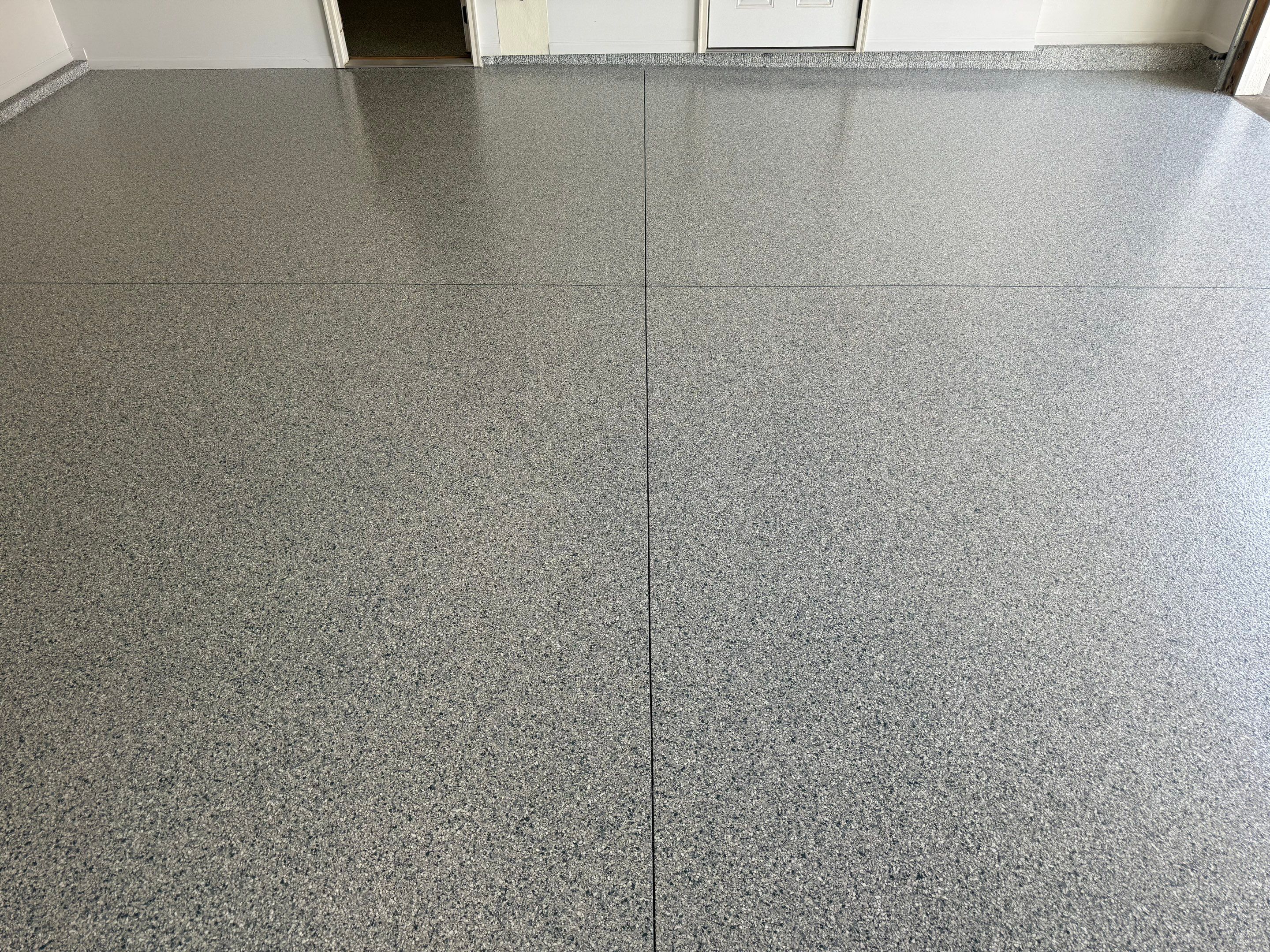 Decorative Chip Epoxy Floor Coating Installation in Sioux Falls by Select Painting, Coatings & Garage Cabinets