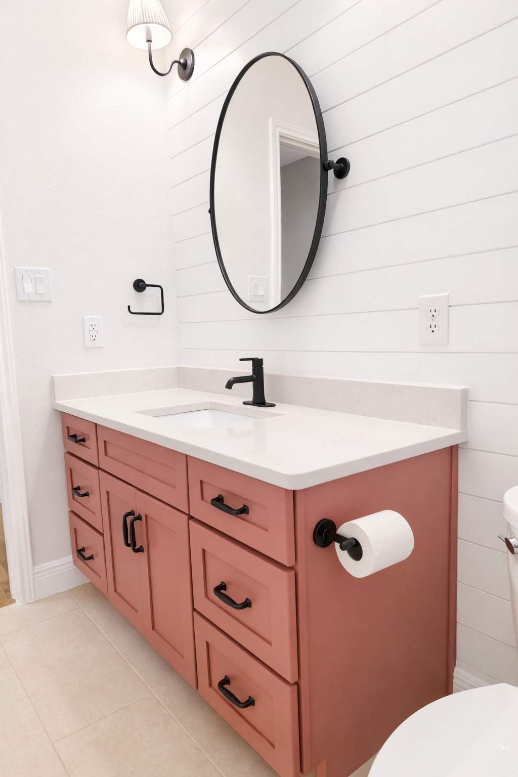 Stone Oak Hall Bathroom Remodel with Pink Vanity and Curved Shower Glass by Legacy Bath and Kitchen