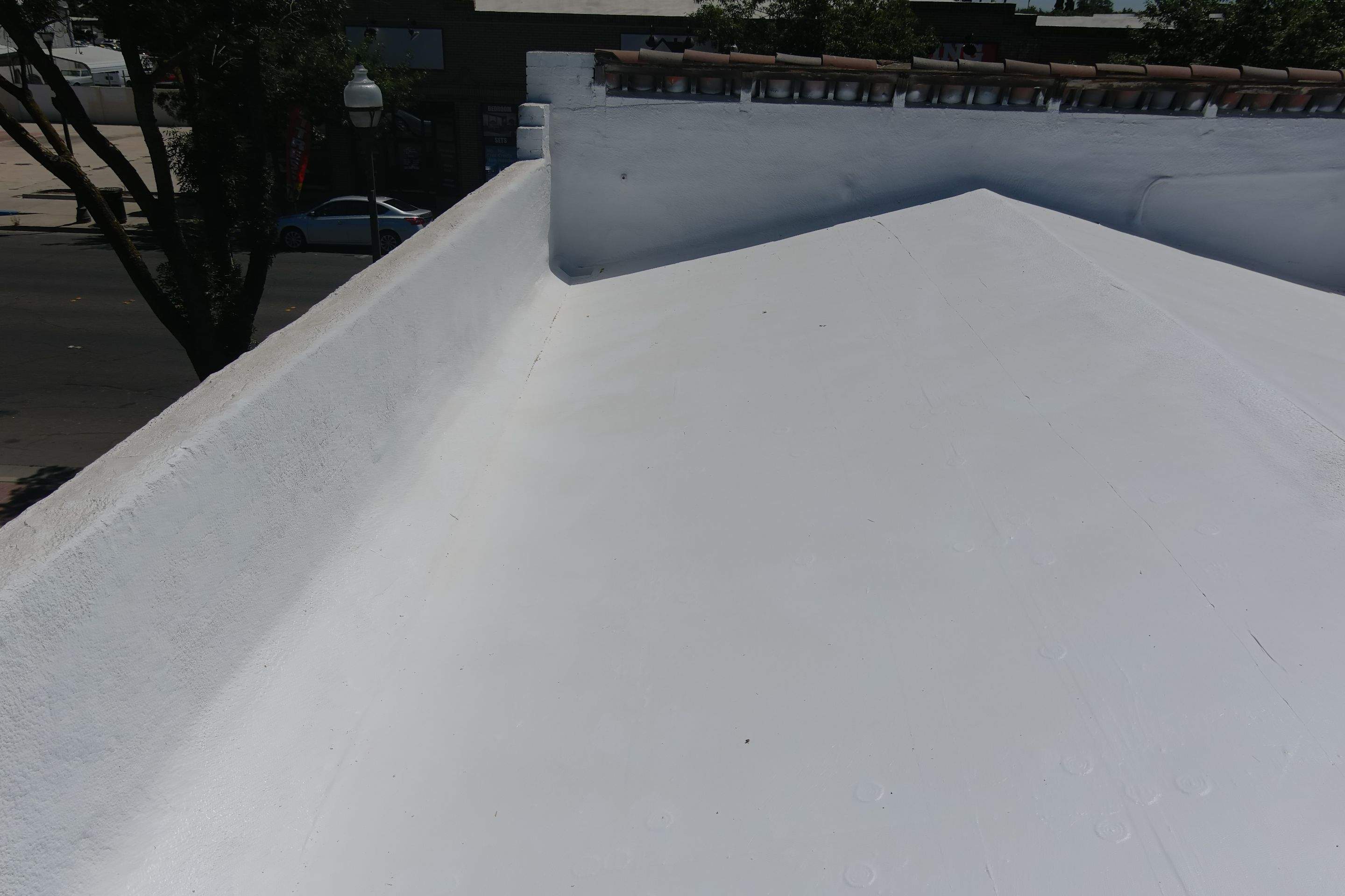 Commercial Roofing Installation using Conklin BenchPly system with PUMA top coat (imbedded fabric system) by Straight Edge Roofing Inc