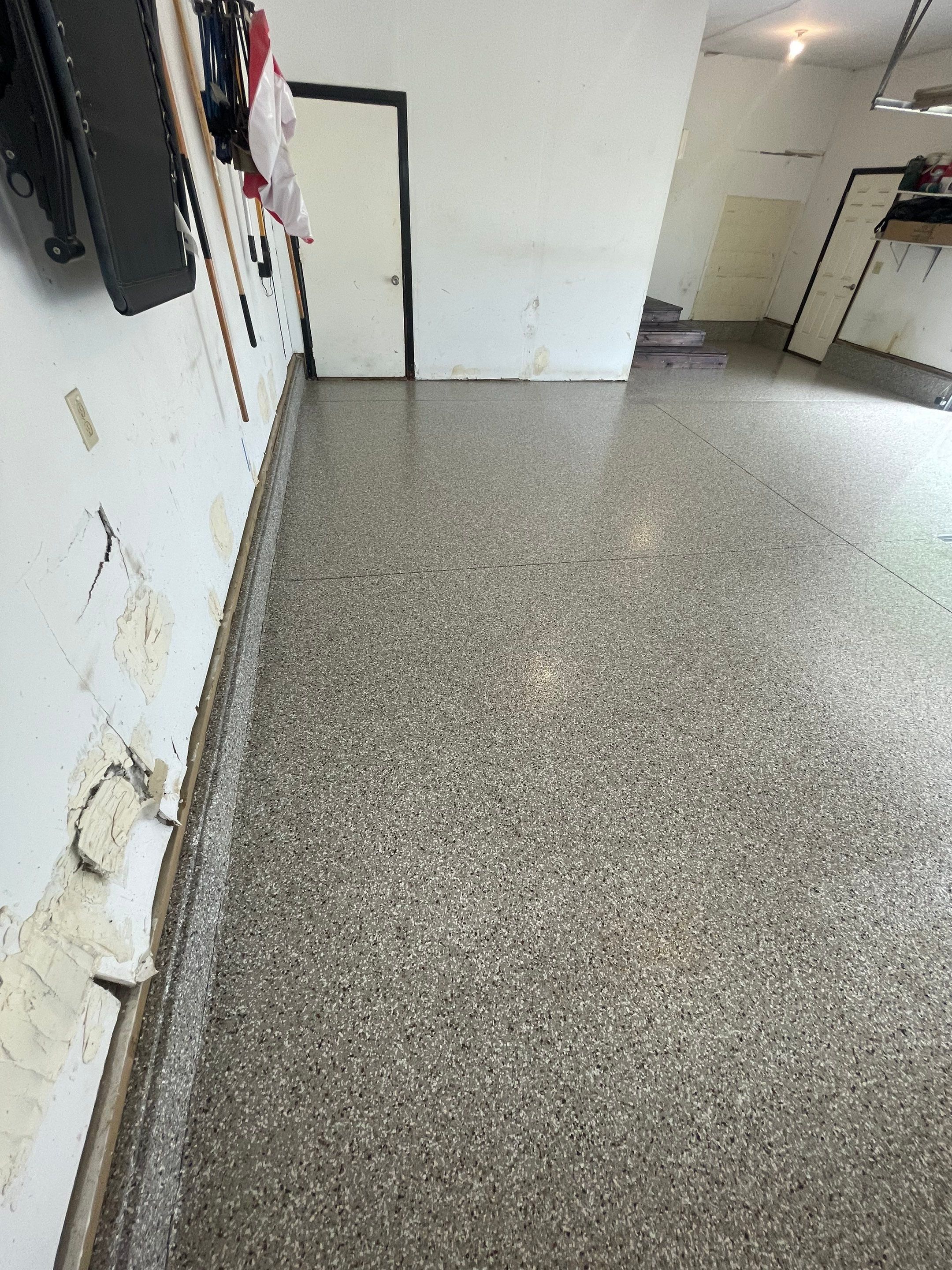 Hartford Residential Garage Floor Transformation With Decorative Chip Coating by Select Painting, Coatings & Garage Cabinets
