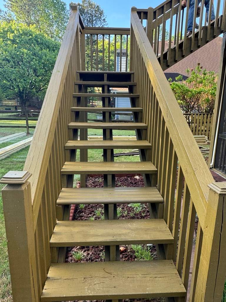 Kennesaw Deck Renovation Featuring Pressure-Treated Lumber and Metal Railings by Swift Home Renovations