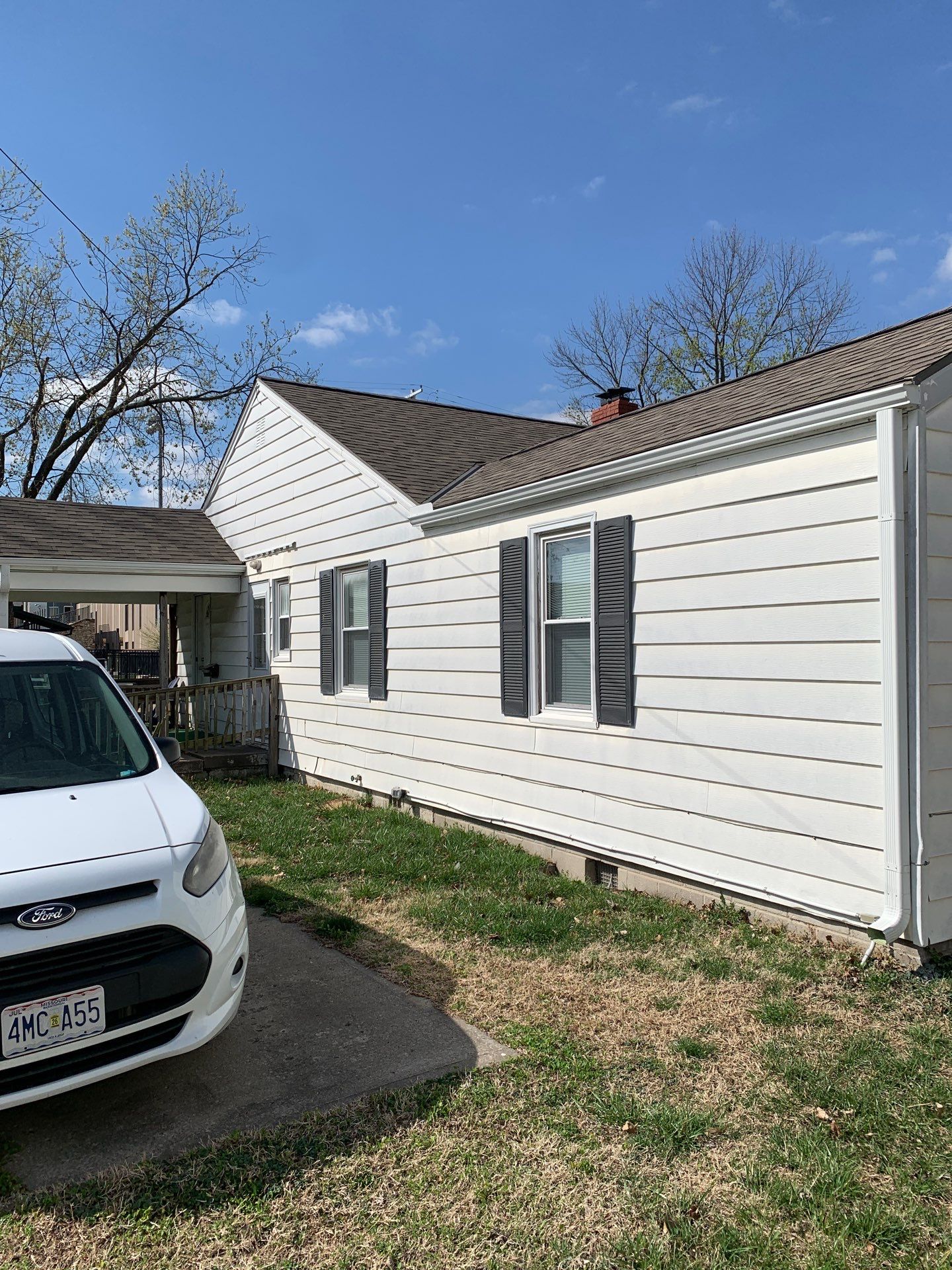 New Cypress Siding going on this North Kansas City Home  by EEC  Windows, Siding & Roofing 
