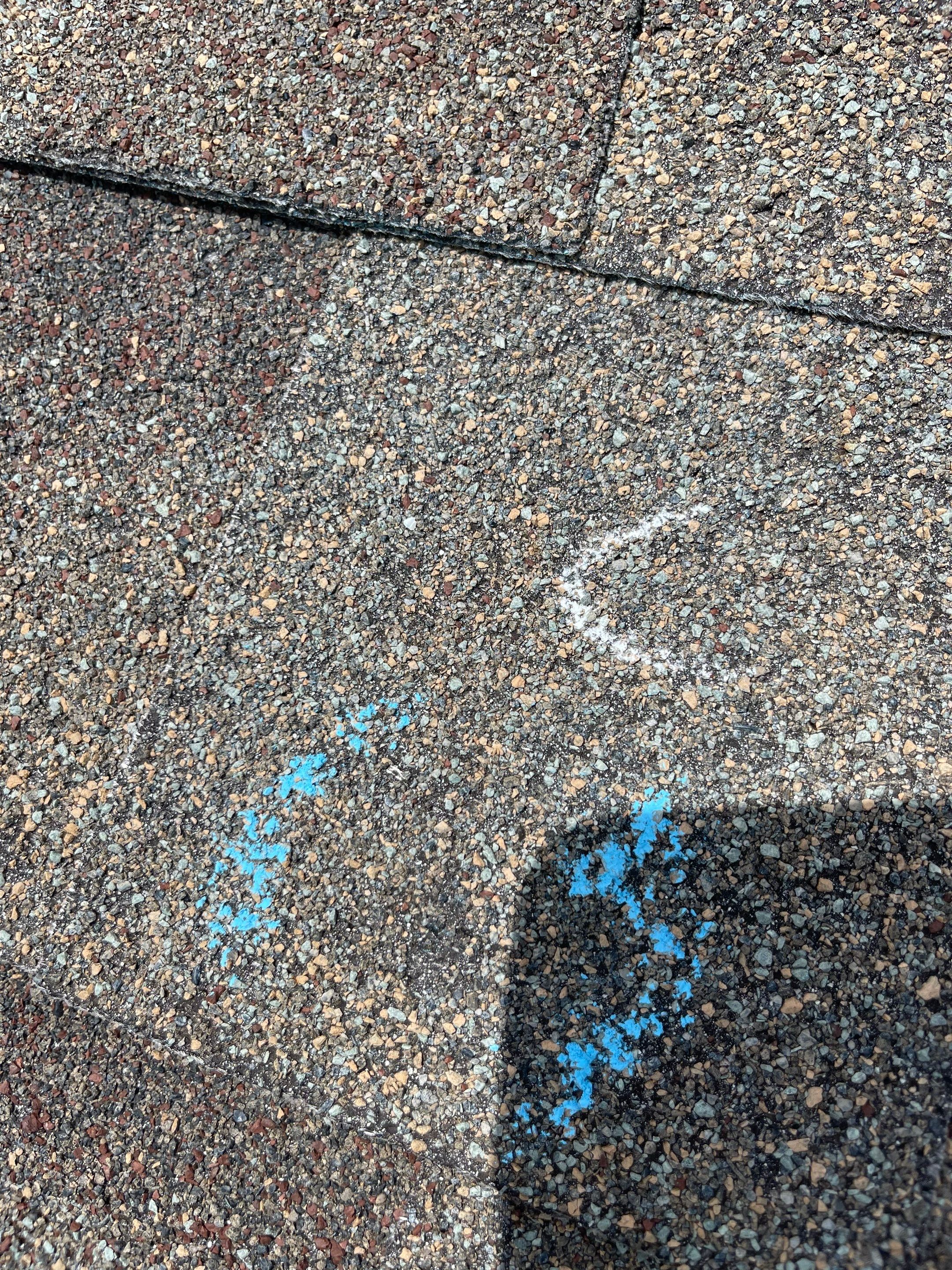 Hail Damage on a Roofing System by Icon Roofing And Construction 