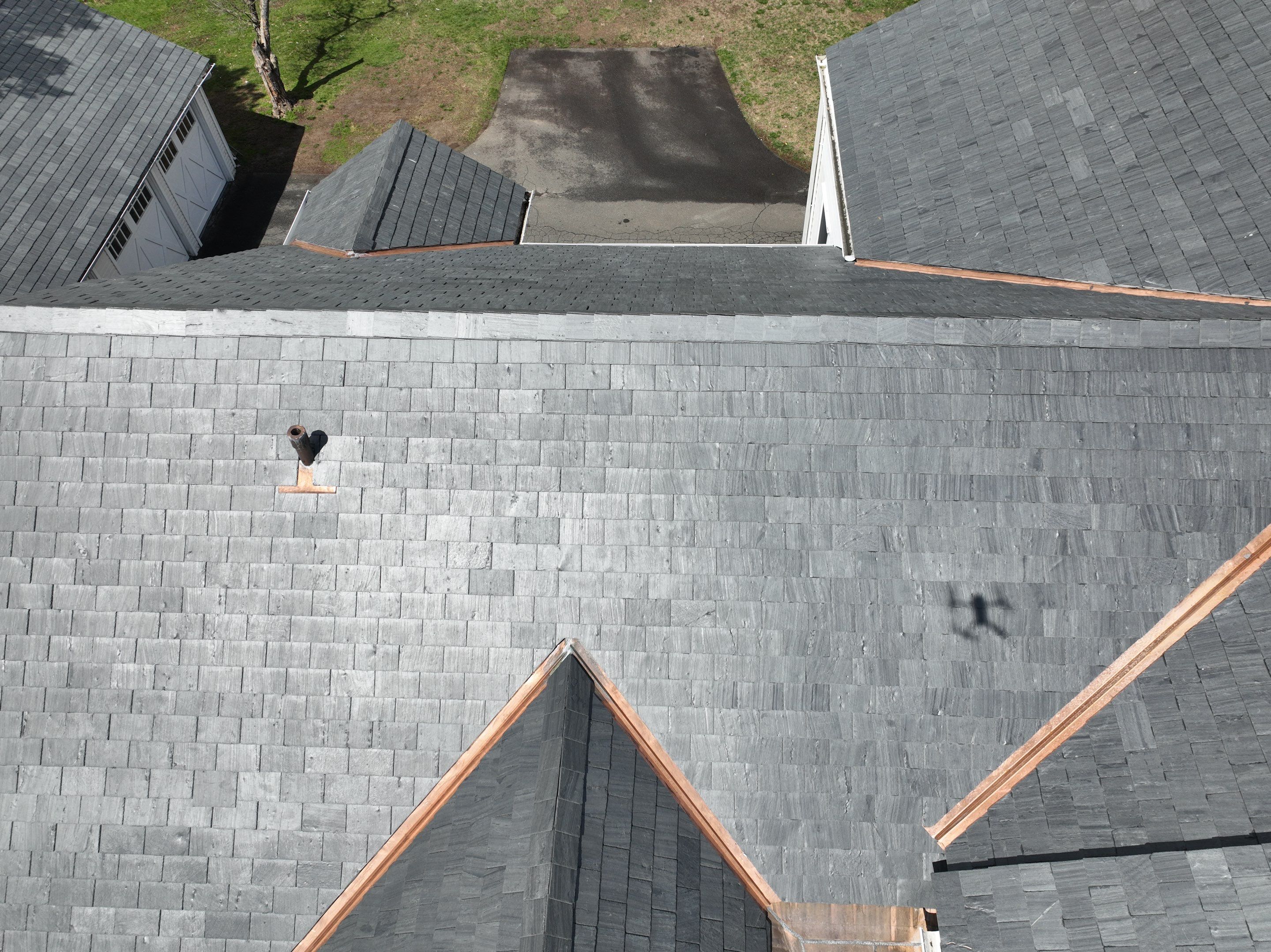 Residential Roofing Installation using Vermont Slate by A Plus Exterior
