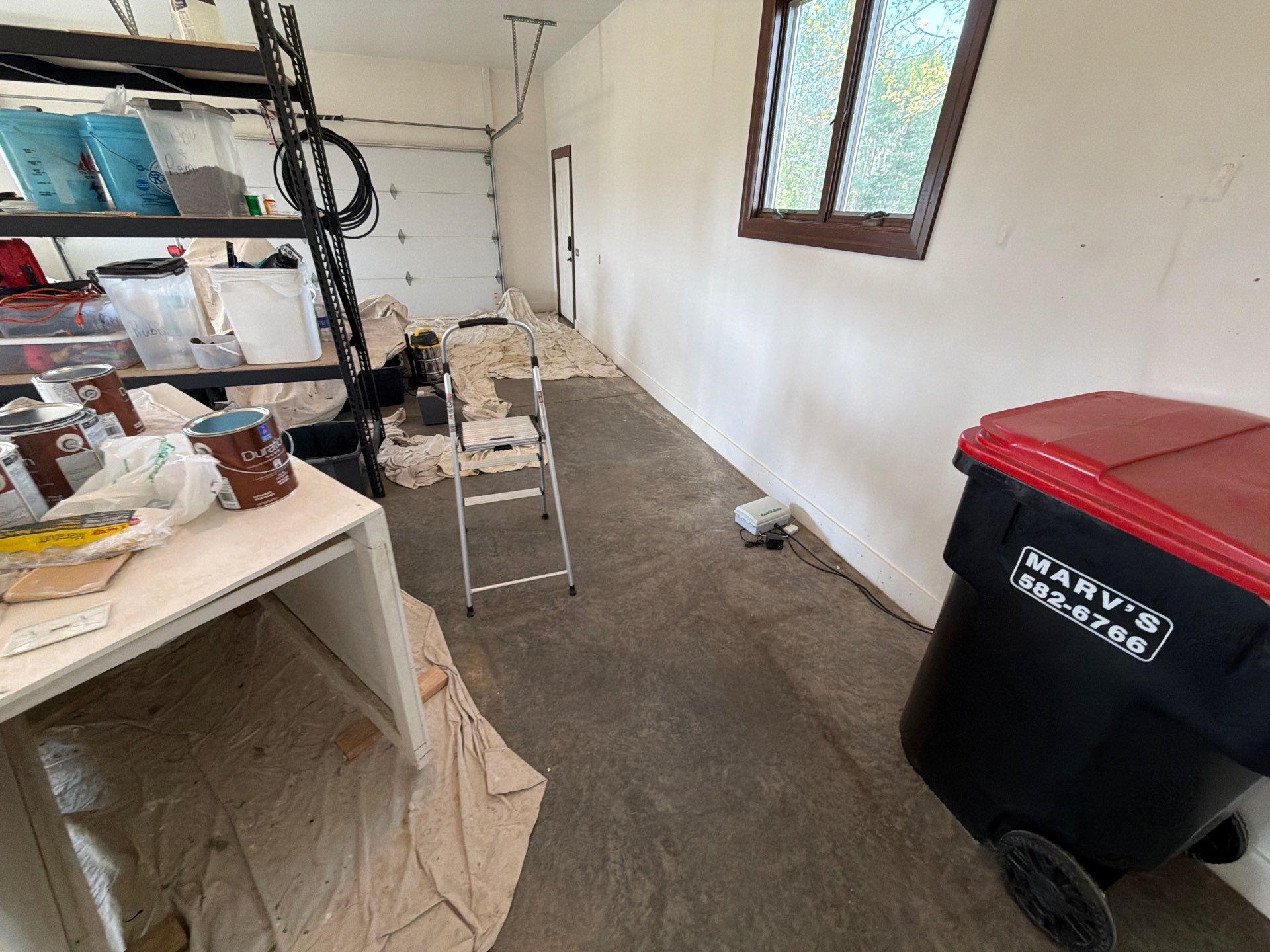 Feather Grey Floor Coating in Sioux Falls, SD by Select Painting, Coatings & Garage Cabinets