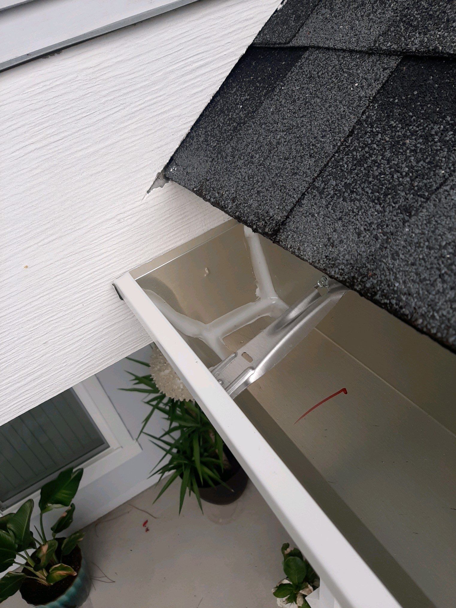 Gutter Installation using White K-Style Seamless Gutters by Gutter Professors