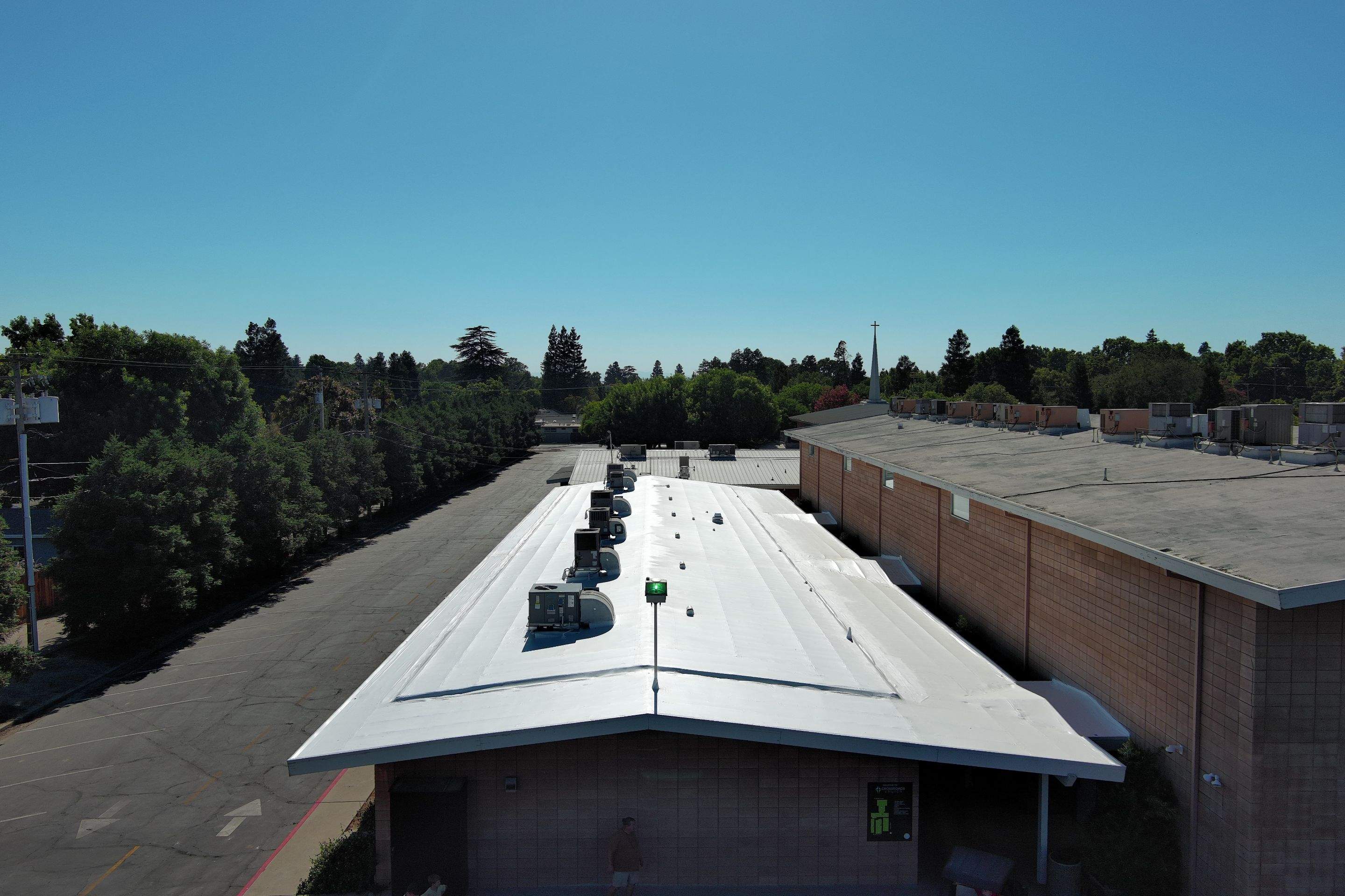 MR Roofing system using Benchmark/PUMA XL coatings over TPO single-ply roofing by Straight Edge Roofing Inc