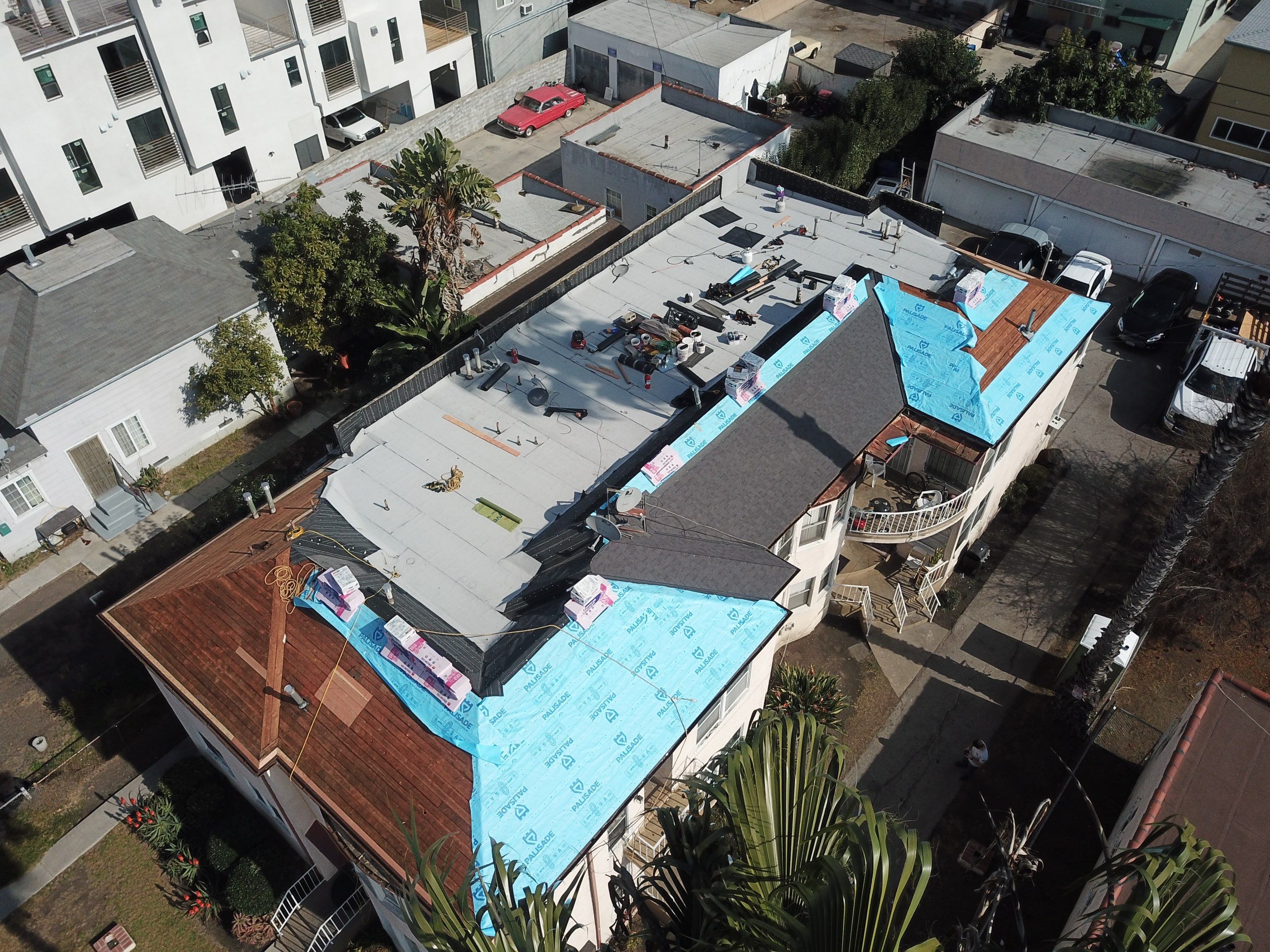 Apartment Building Roofing Installation using CertainTeed GTA Modified Bitument System by Hull Brothers Roofing
