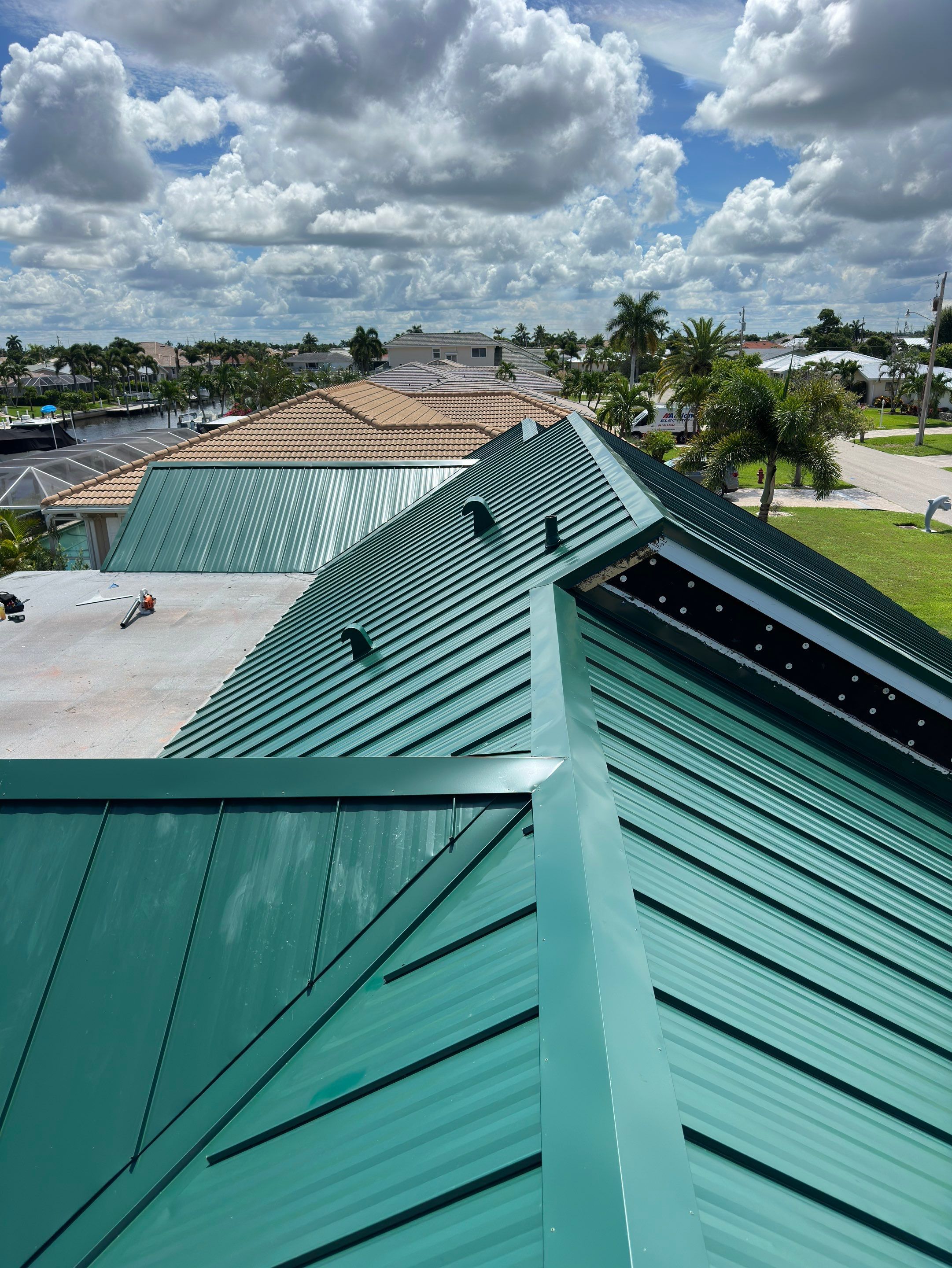 Residential Roofing Installation using Gulf Coast Metals Gulf Seam Panels by Four Peaks Roofing