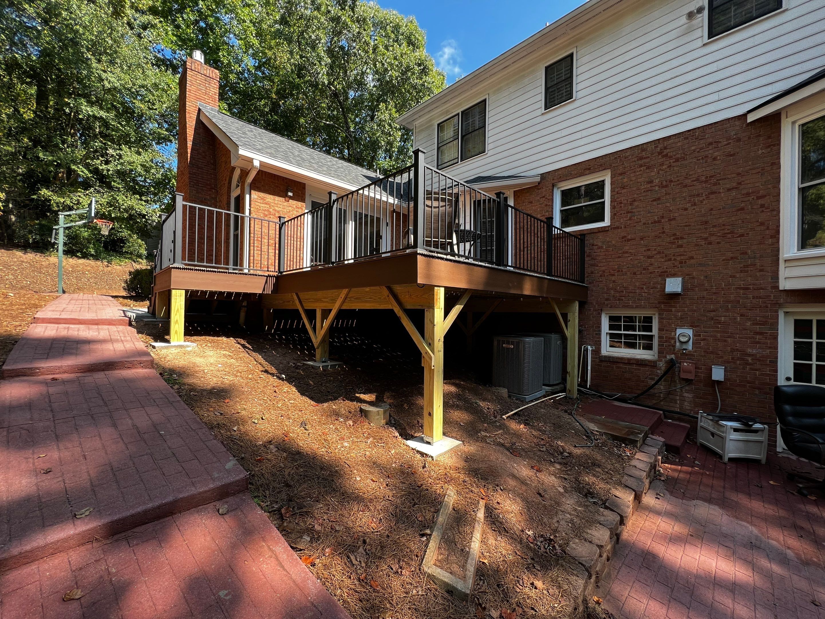 Elevated Composite Deck Installation with Metal Railings in Atlanta by Swift Home Renovations