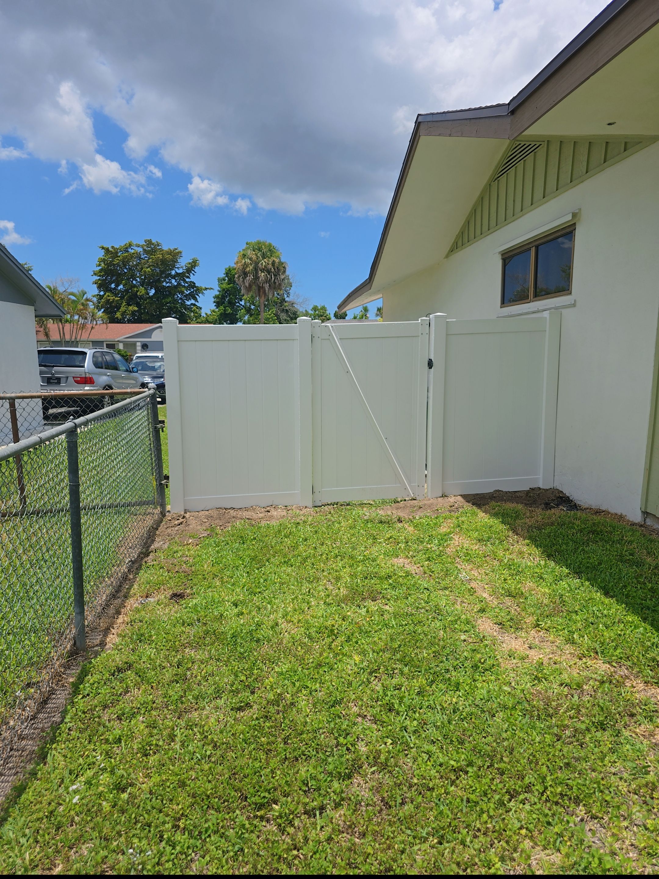 Residential Chain Link Fence Repair and Vinyl Privacy Gate Installation in Naples by True Fence LLC