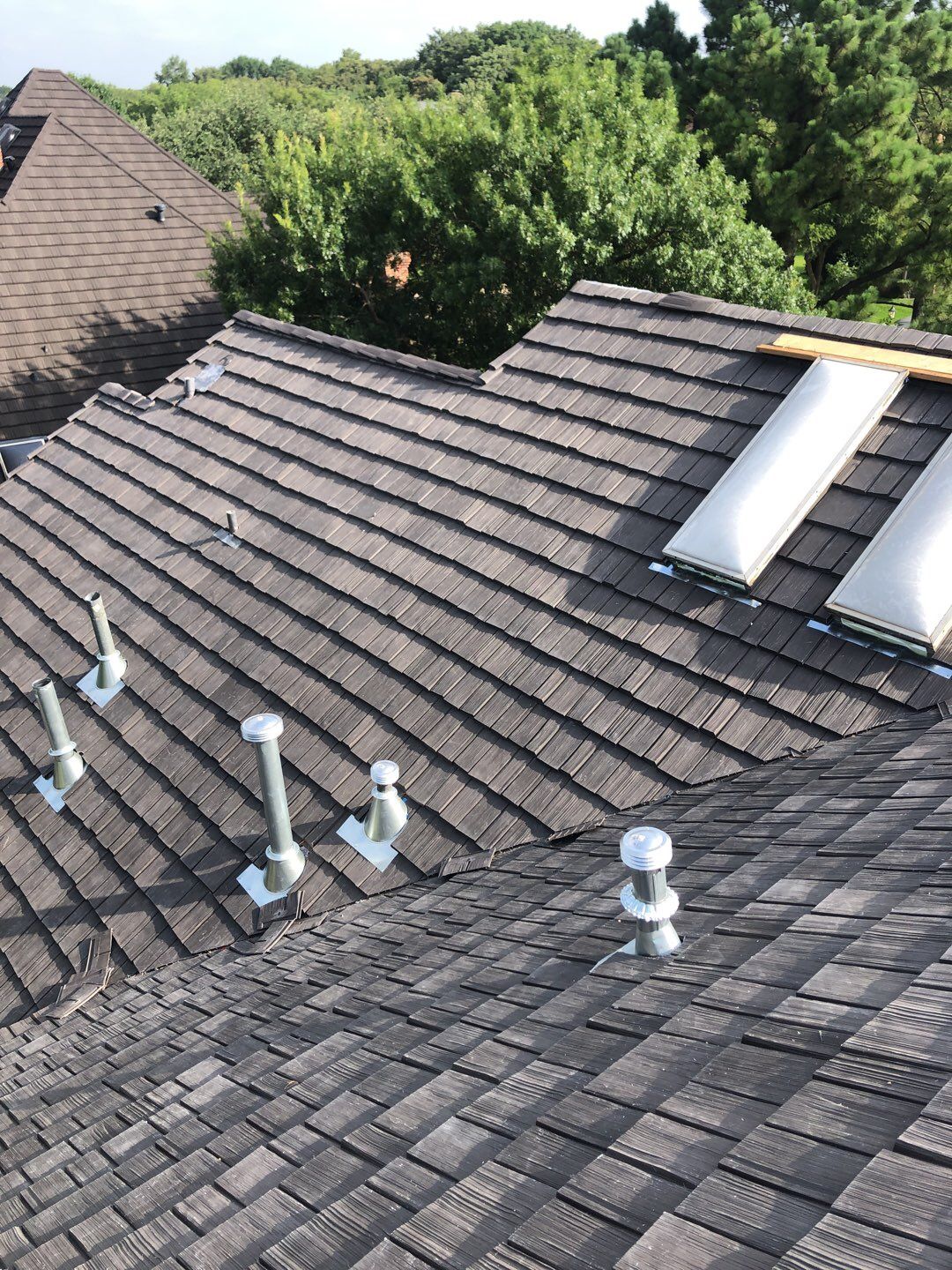 Designer Residential Roof with Zip System by Springtree Restoration