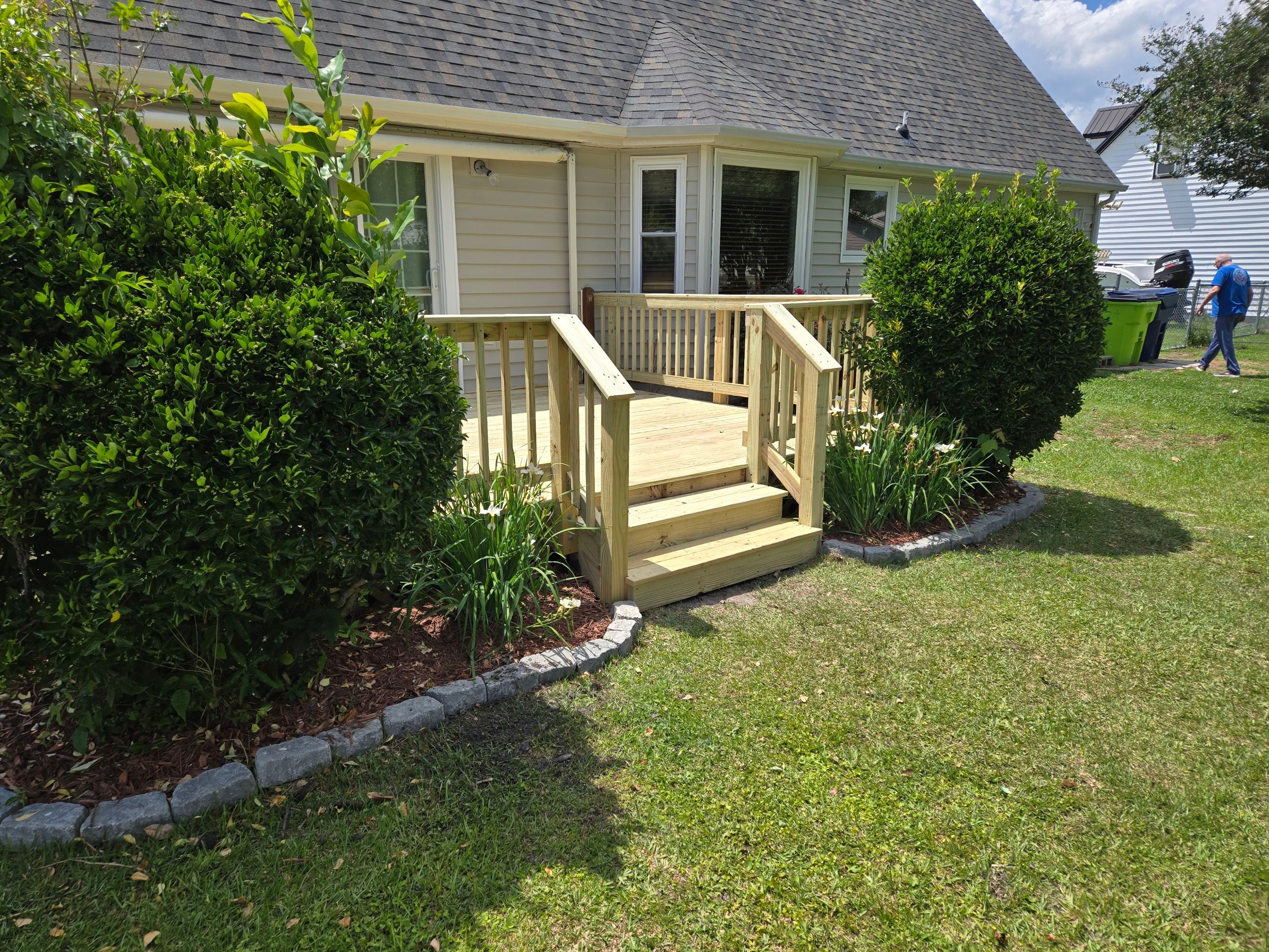 Pressure-Treated Wood Deck Resurface and Railing Upgrade in Havelock by The Remodeling Company