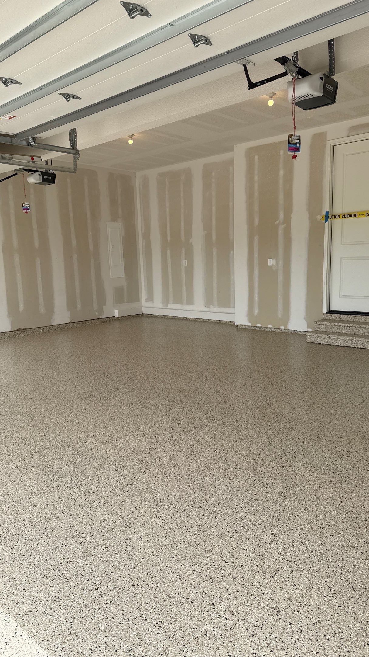 Raymore Garage Finishing With Custom Epoxy Floor Coating by Banner Garage