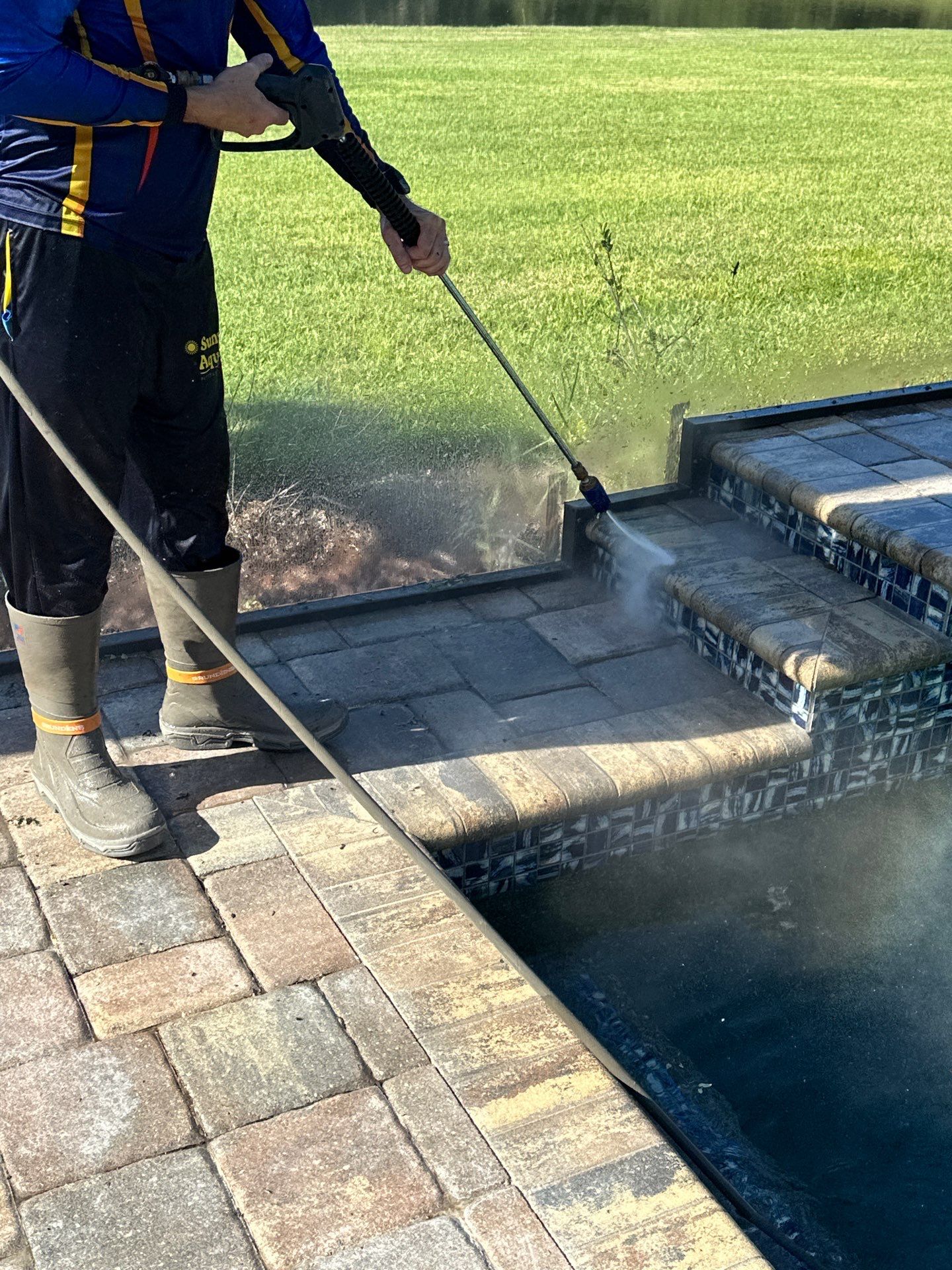 Paver Driveway, Sidewalk, and Pool Deck Cleaning in Winding River Community, Bradenton, FL by Sunshine AquaWash