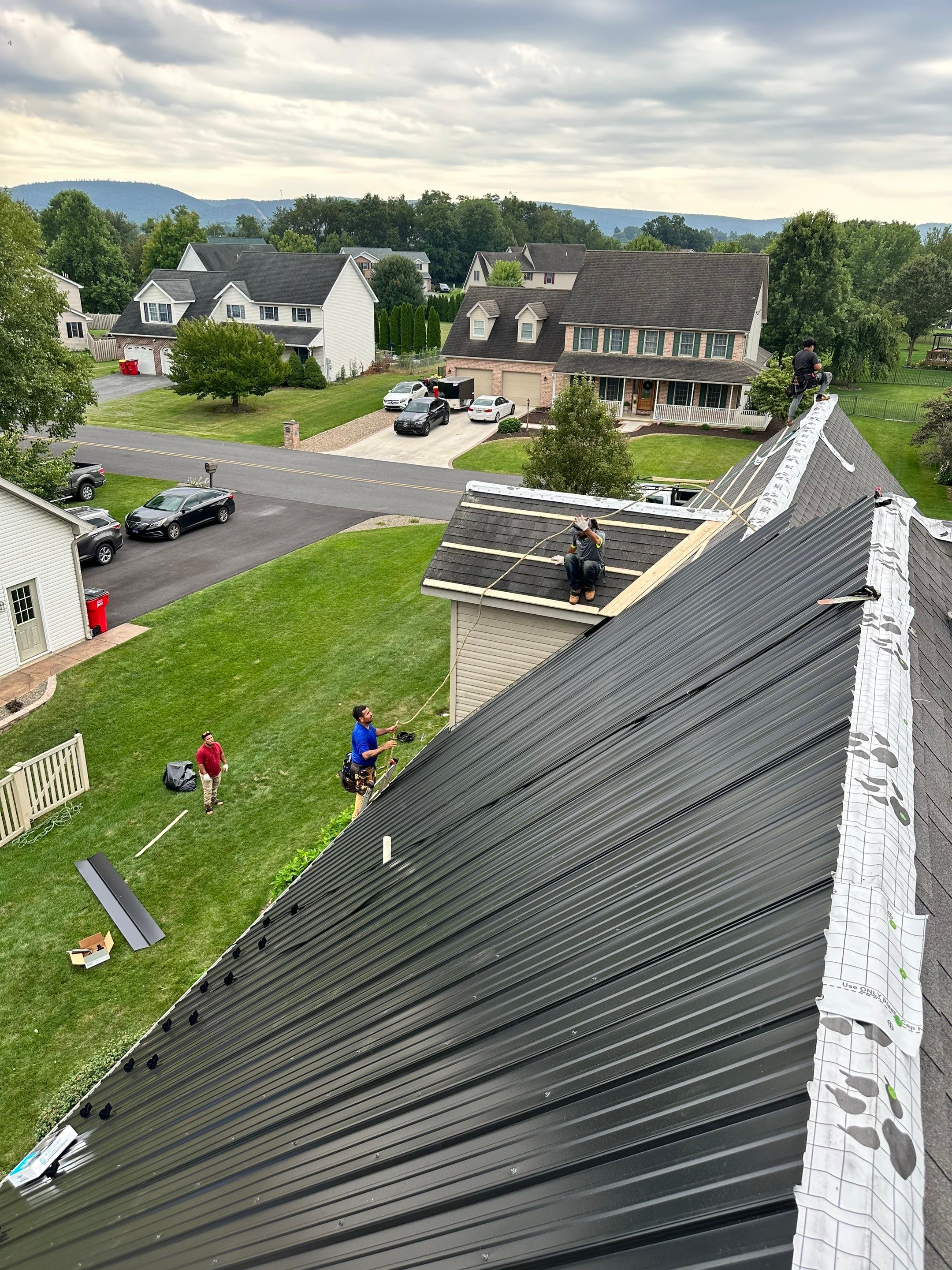 Standing seam / Azm panel in black  by Teflon Roofing