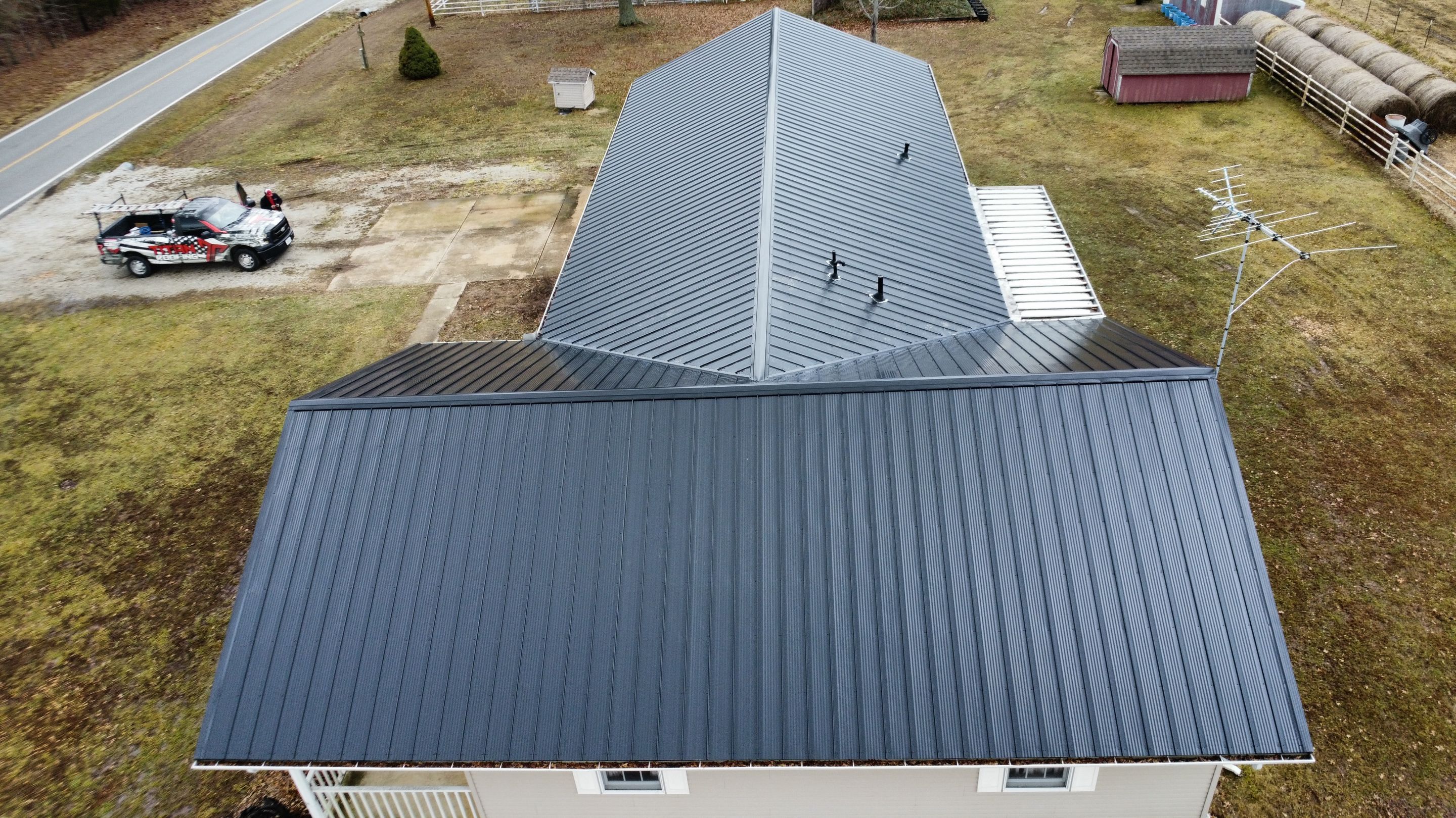 Residential 26 Gauge M-Rib Metal Roof + Gutters, Downspouts & Gutter Covers Install  by Titan Commercial & Residential Roofing 