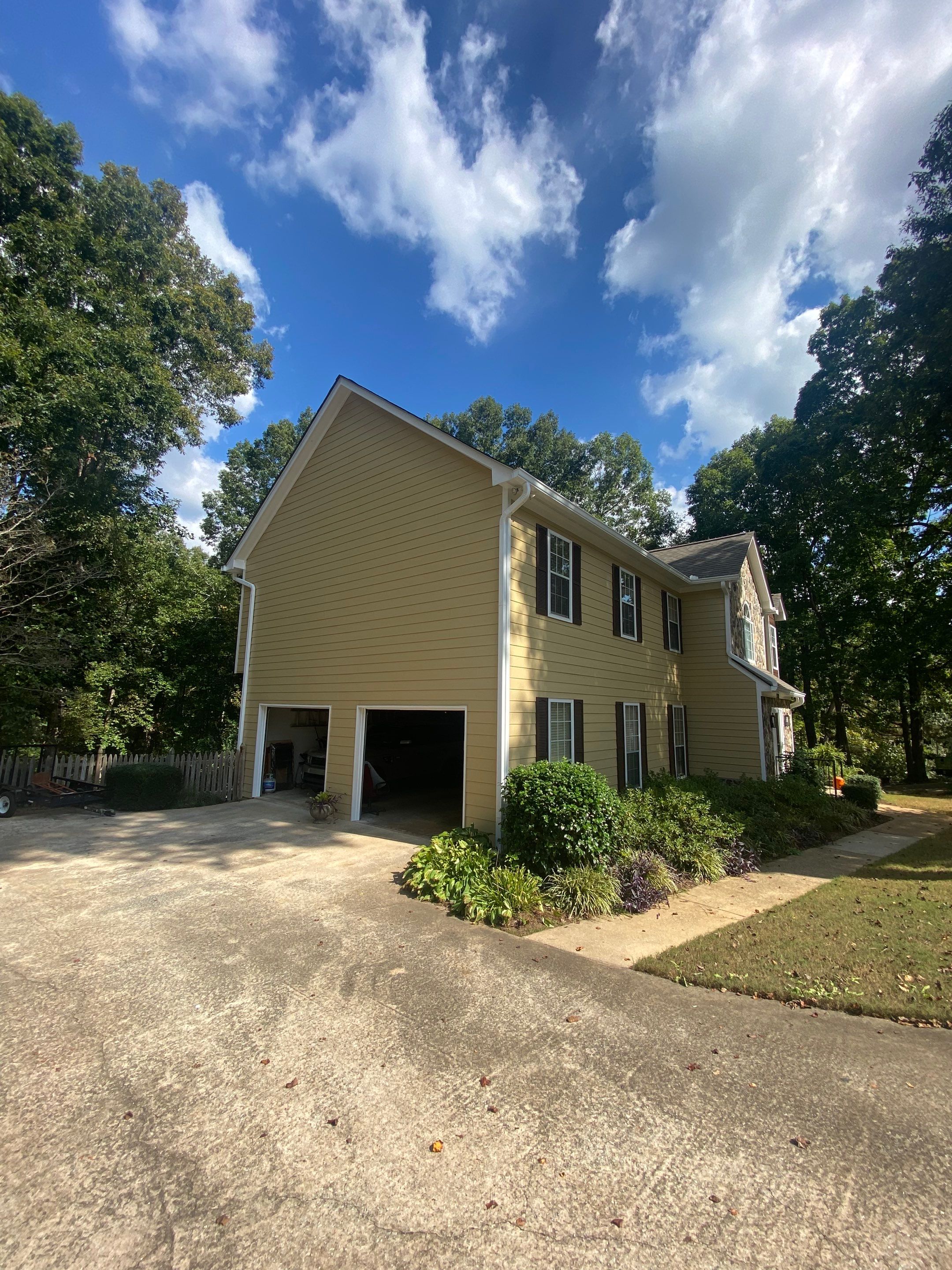 Full Exterior House Painting for Suburban Residence in Douglasville by Swift Home Renovations