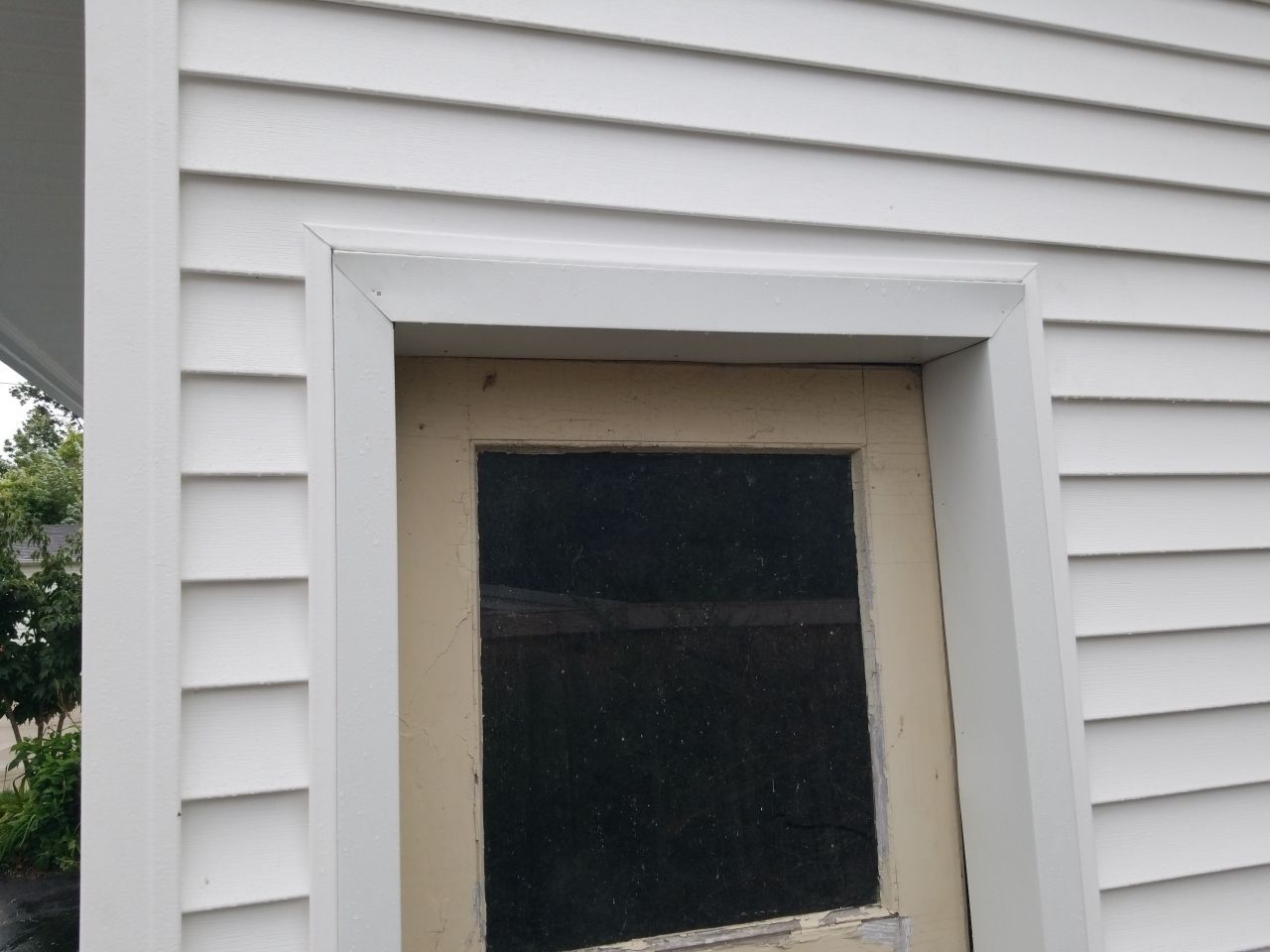 Residential Roofing Installation, Dec-tek walk-out porch roof, siding on garage by Absolute Roofing and Construction