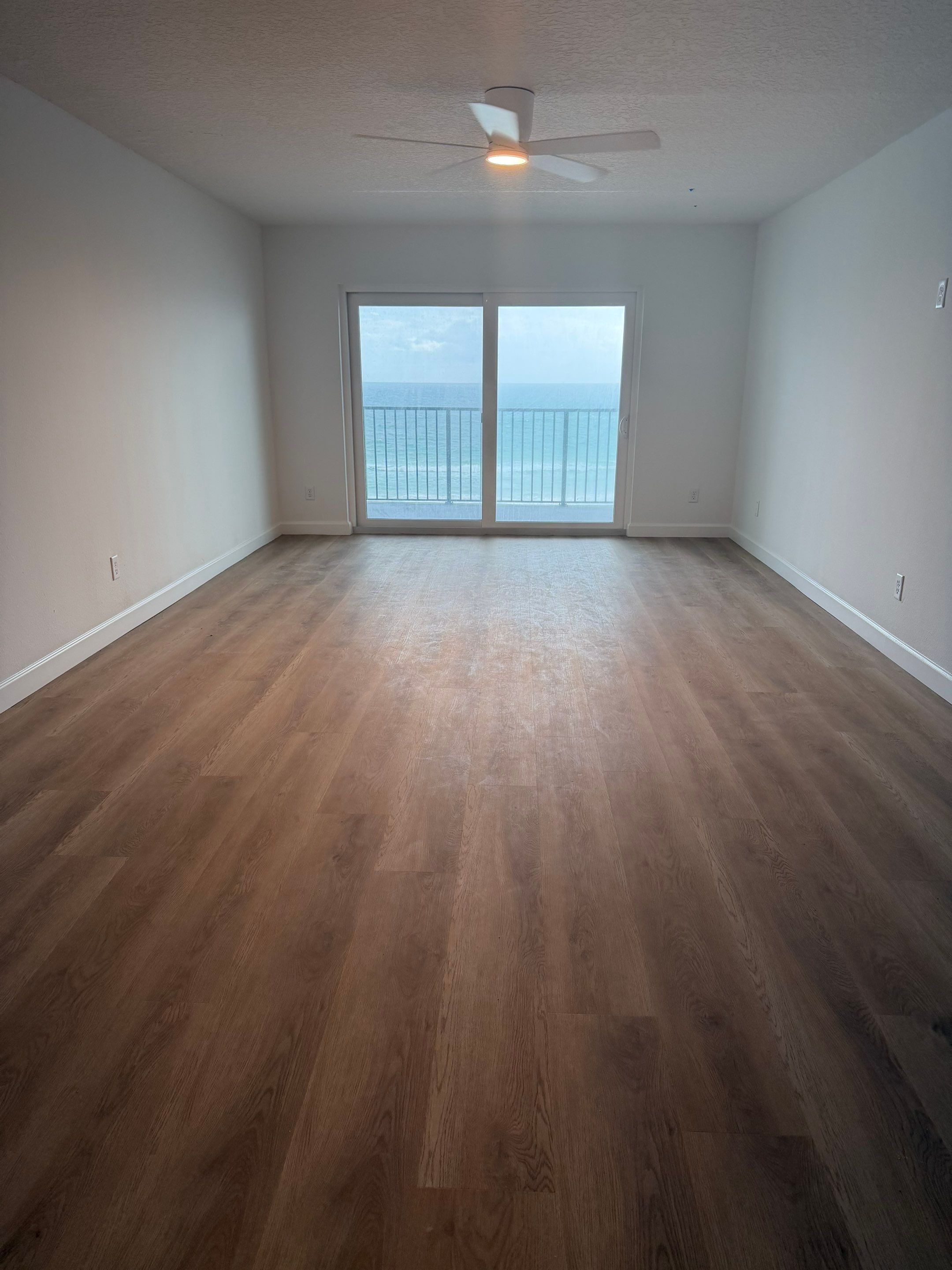 Full Condominium Remodel Featuring Aubrey Oak Flooring In Daytona Beach by Acies Renovations
