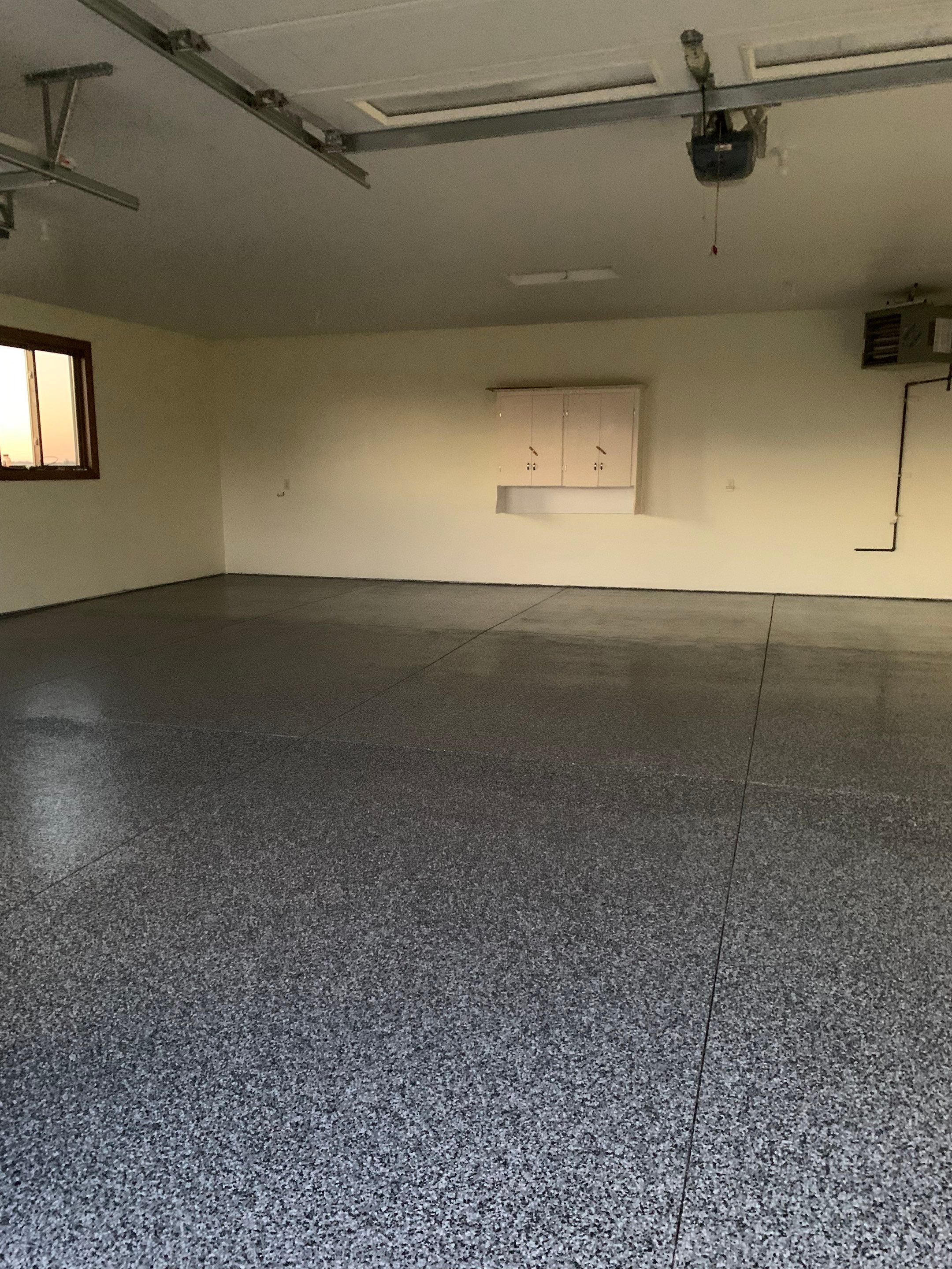 Speckled Epoxy Garage Floor Coating and Concrete Repair in Lennox by Select Painting, Coatings & Garage Cabinets