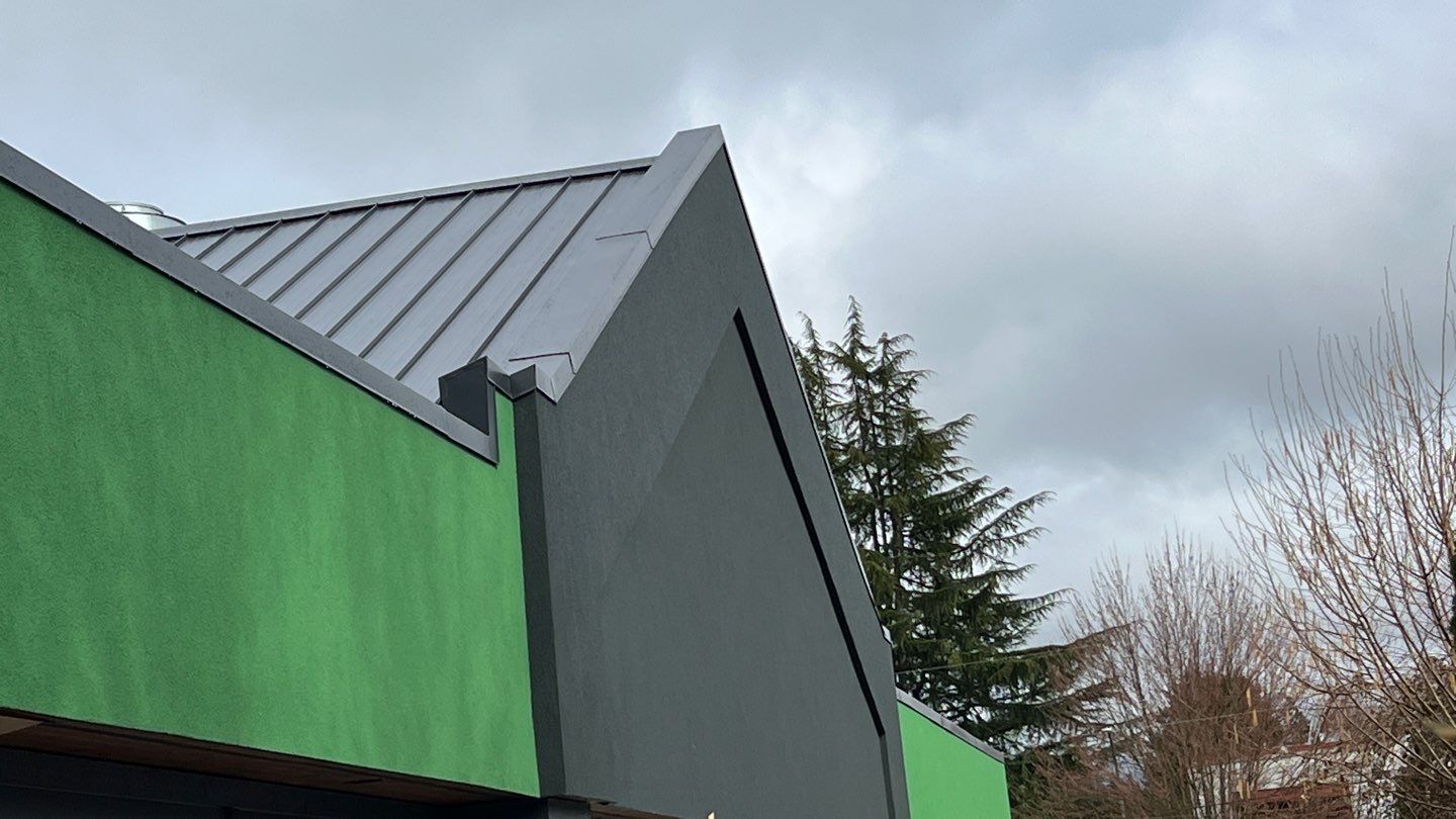Commercial Roofing Installation using 12" Prolok metal and hidden gutters! by Top Notch Roofing Inc
