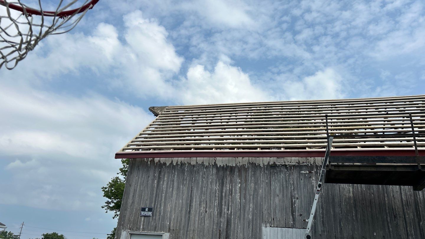 Residential Roofing Installation using Standing Seam Metal - Barn Red by RoofX 