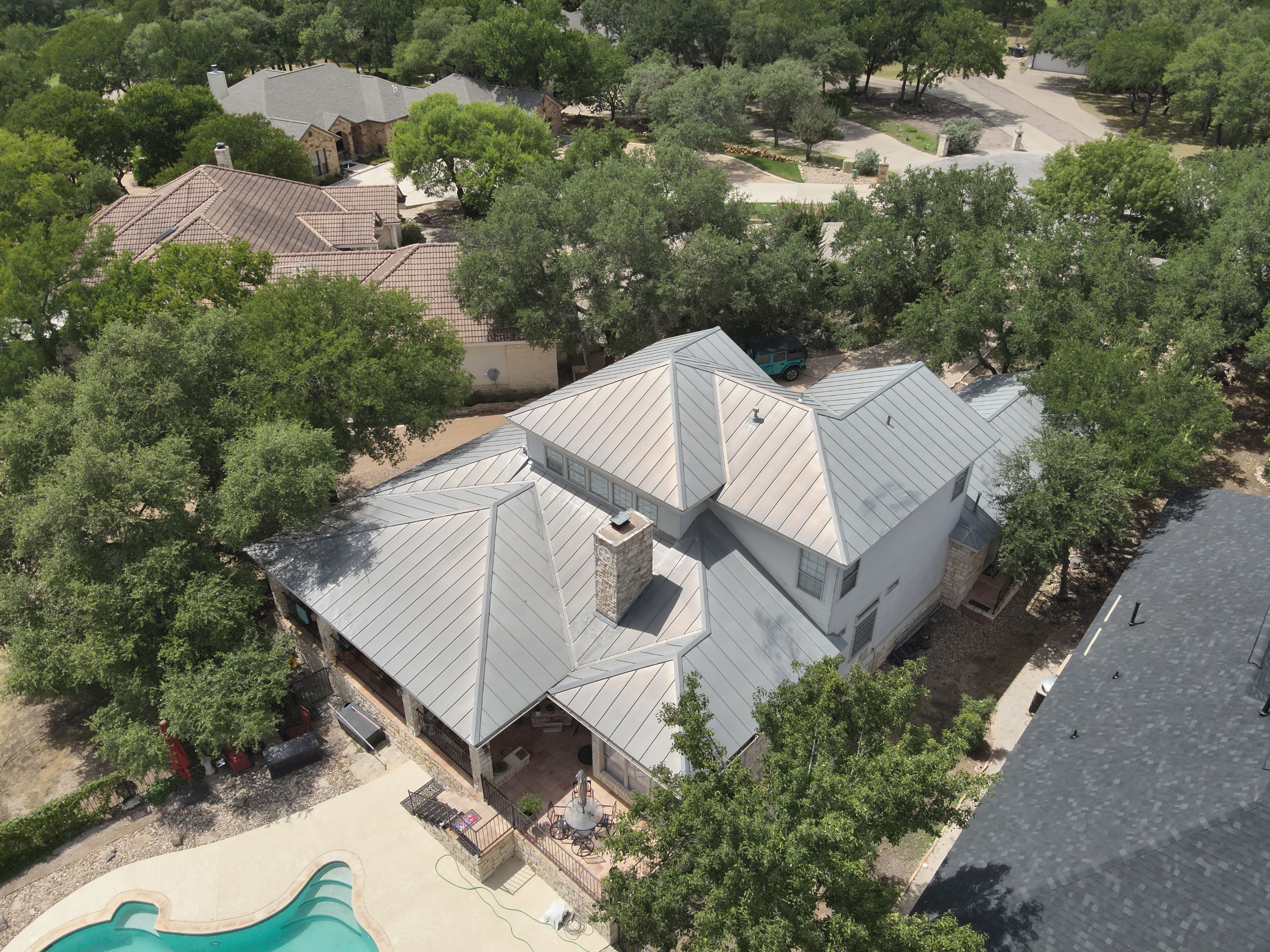 Residential Roof Replacement using 24 GA Double-Lock - Surrey Beige by Action Exteriors Austin