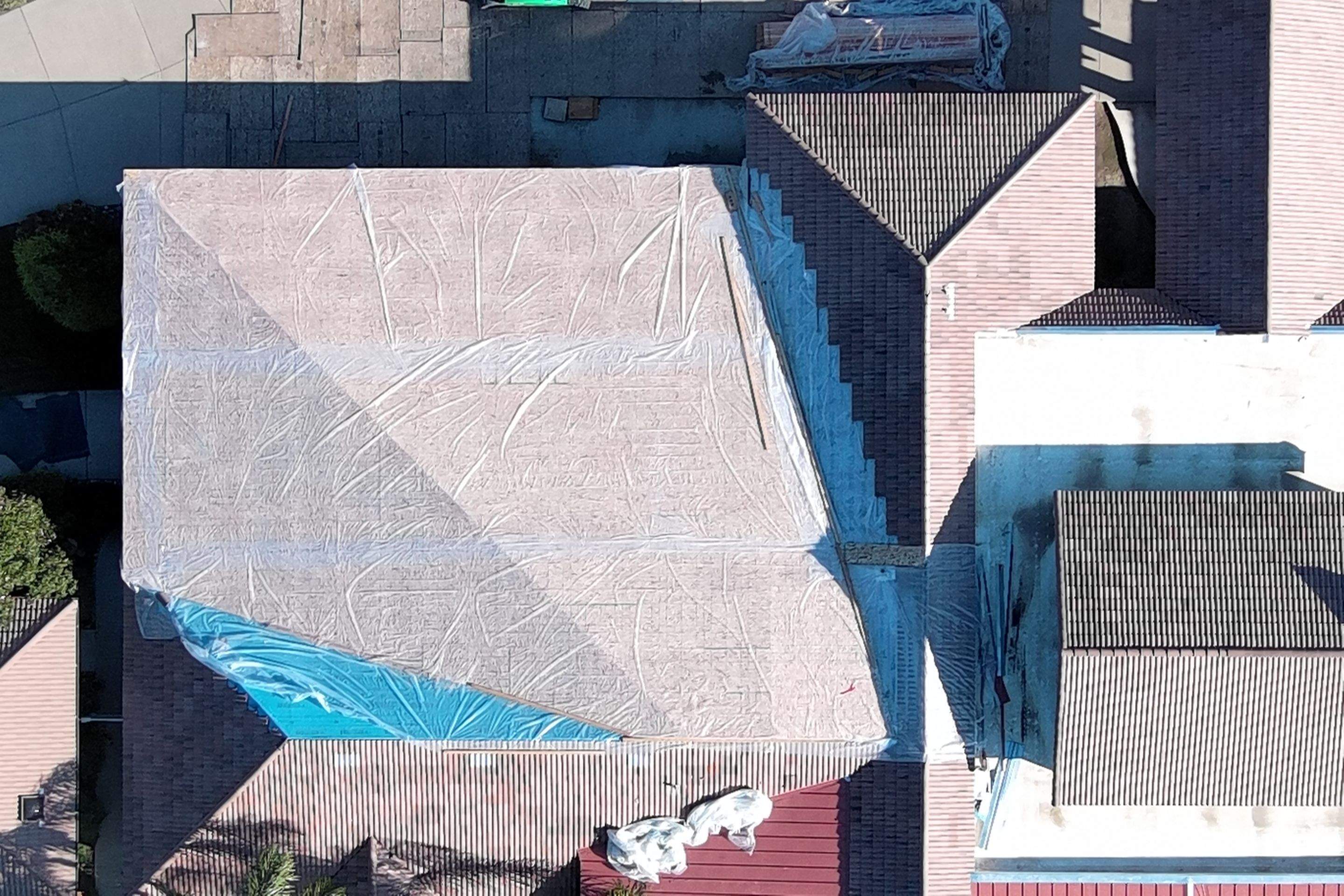 Tile, Metal, and TPO roofing project (new construction) by Straight Edge Roofing Inc