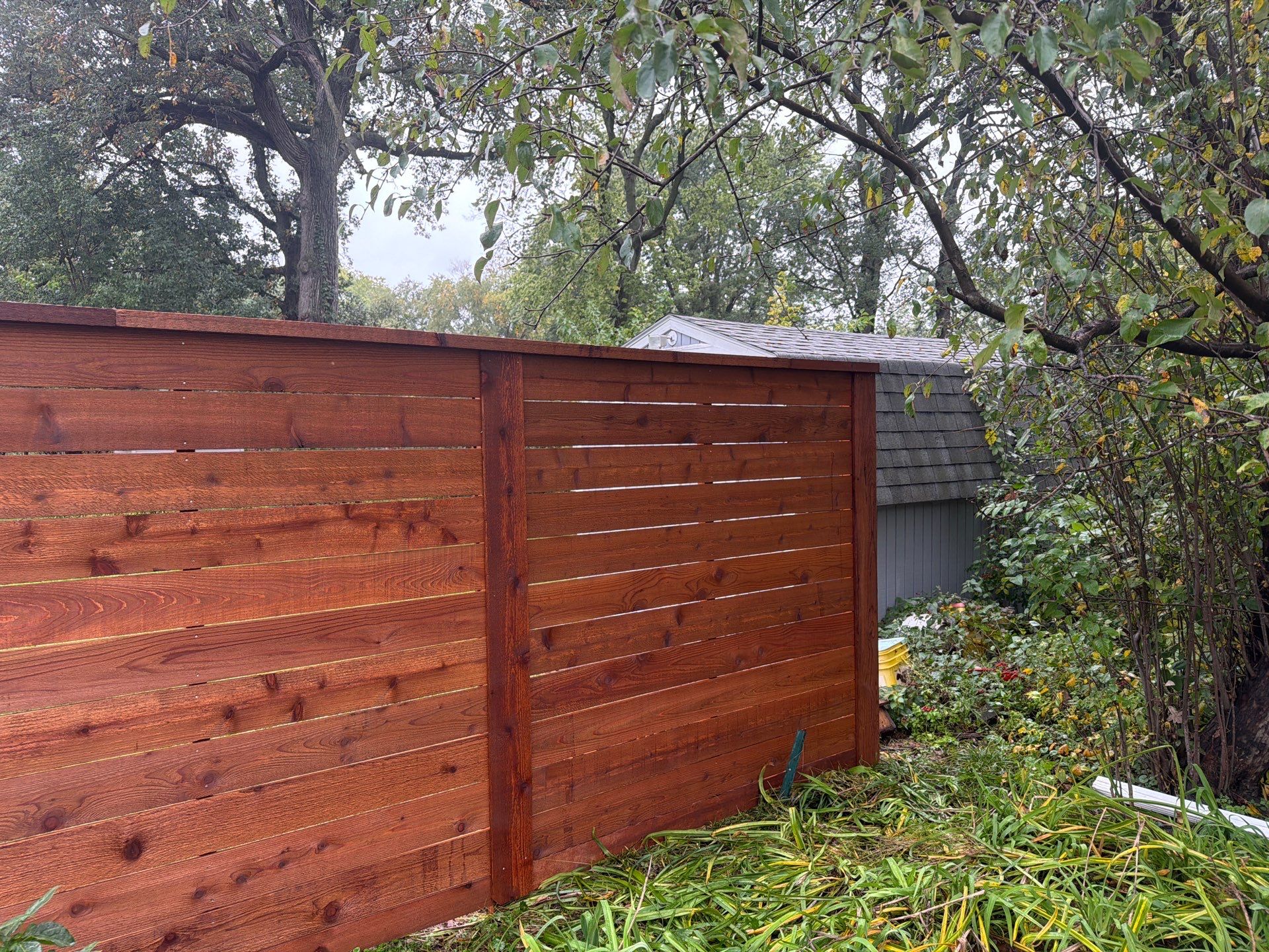 Stained Horizontal Cedar Wood Privacy Fence in Cedar Falls by Perfect Picket Fence and Stain