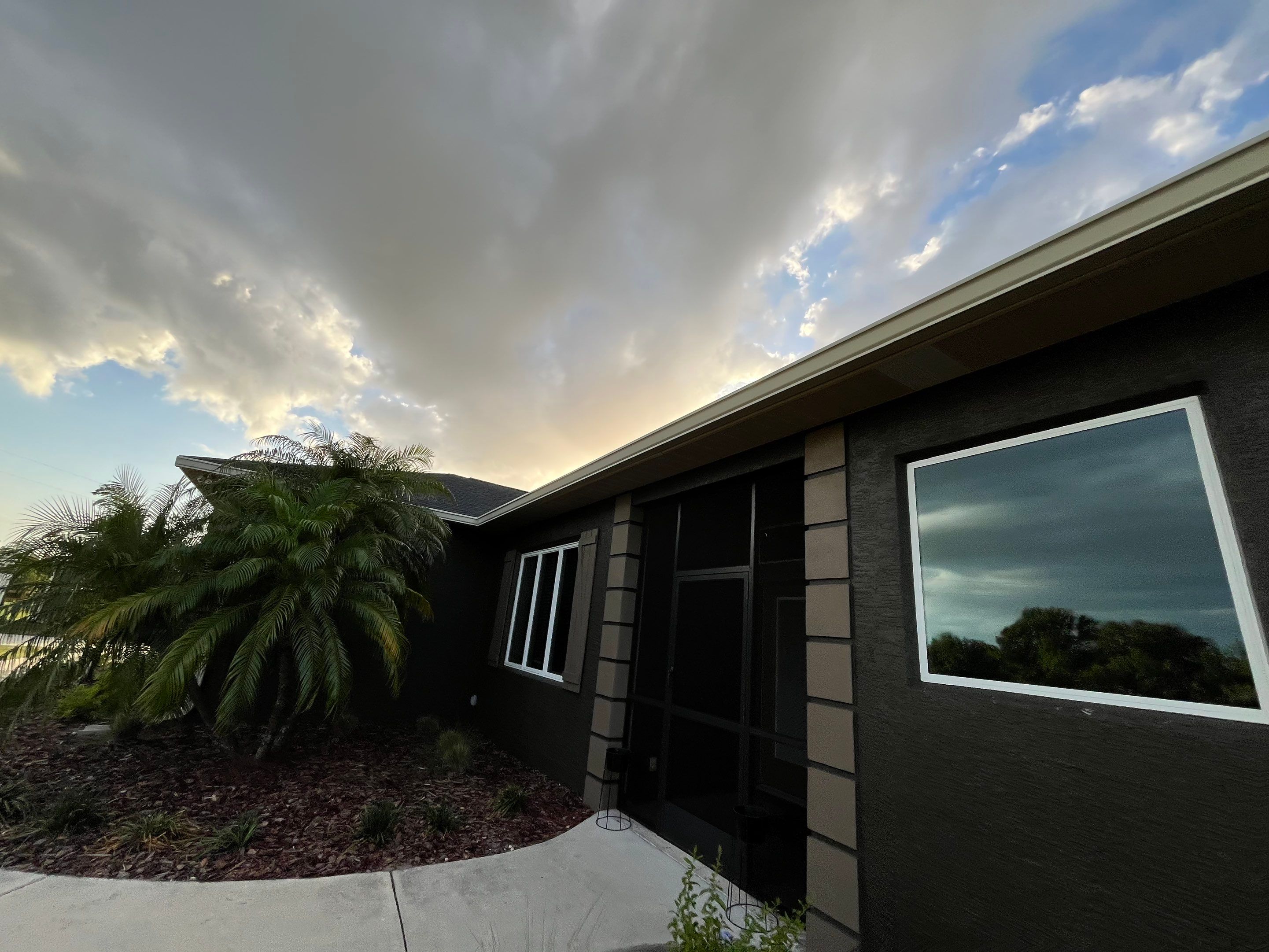  7-inch White seamless gutters and downspouts in Myakka City FL by Gutter Professors