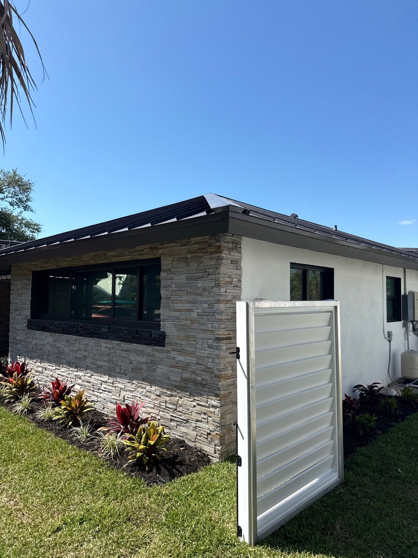 7-Inch Smooth Box Seamless Gutters using black seamless gutters in Siesta Key Fl by Gutter Professors