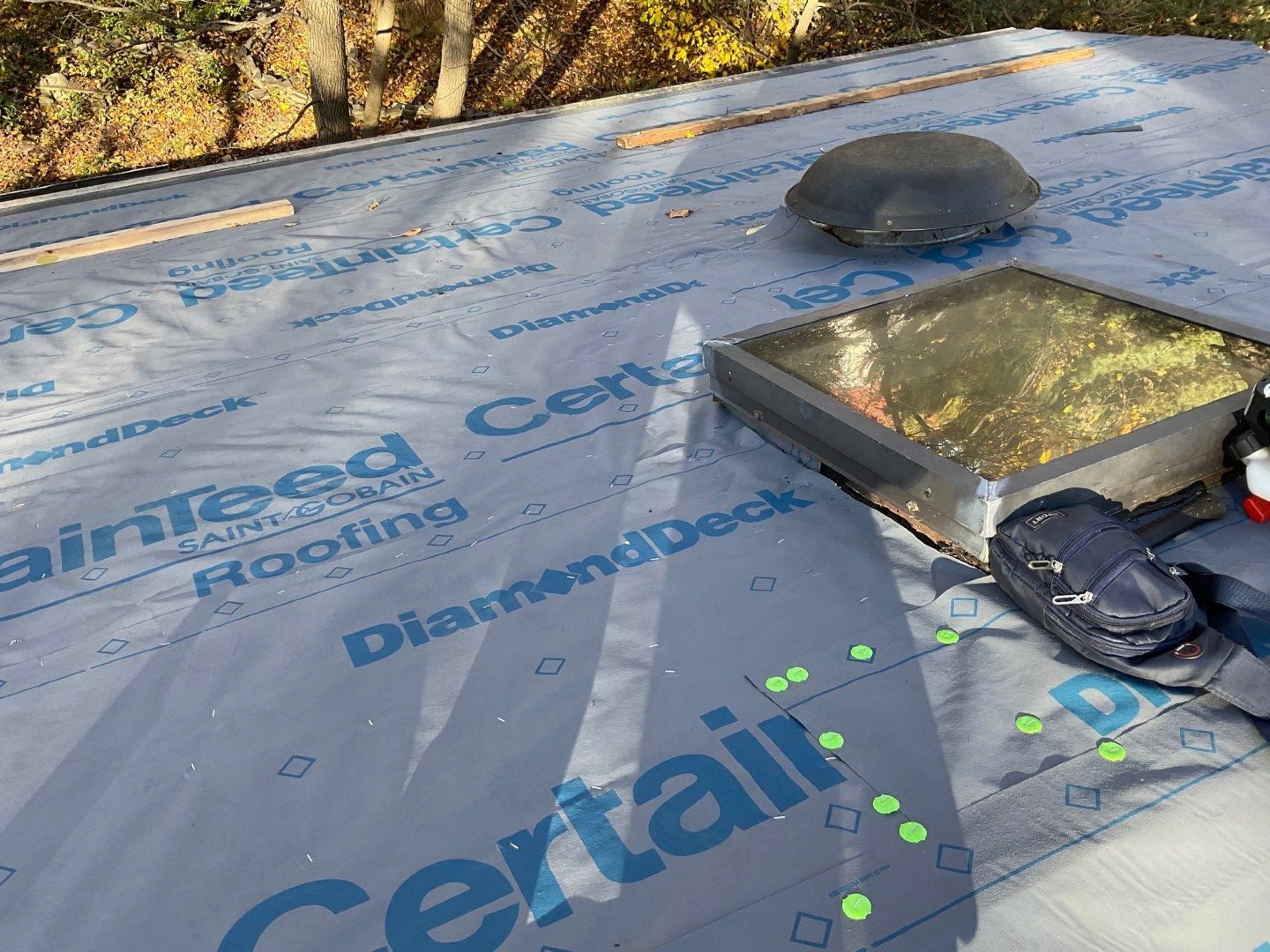 Install new shingles and new skylights  by Alpha Design Services