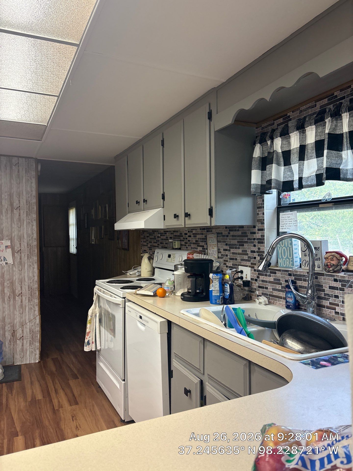 Modernized Kitchen with Gray Painted Cabinets and Tile Backsplash by CompanyCam Sales Demo
