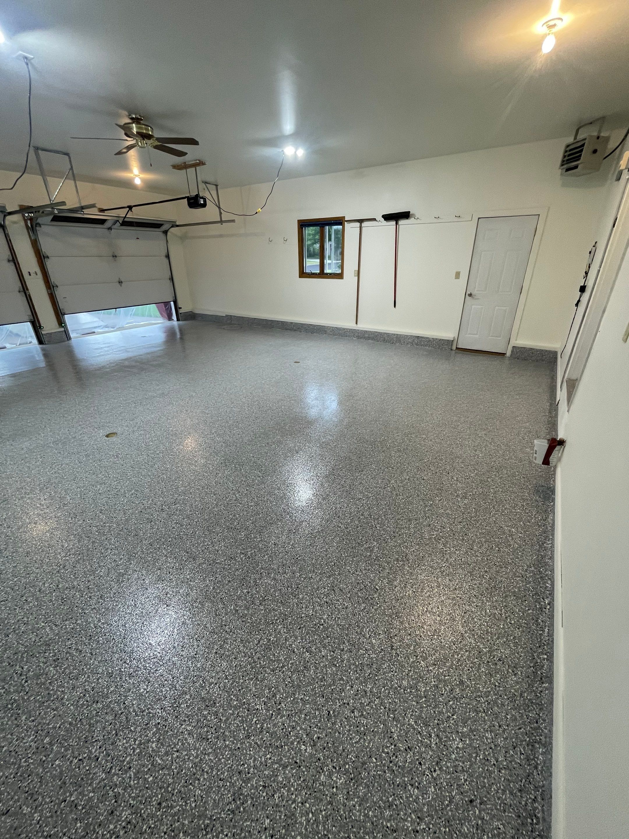 Madison Garage Concrete Coating with Feather Grey Speckle Finish by Select Painting, Coatings & Garage Cabinets