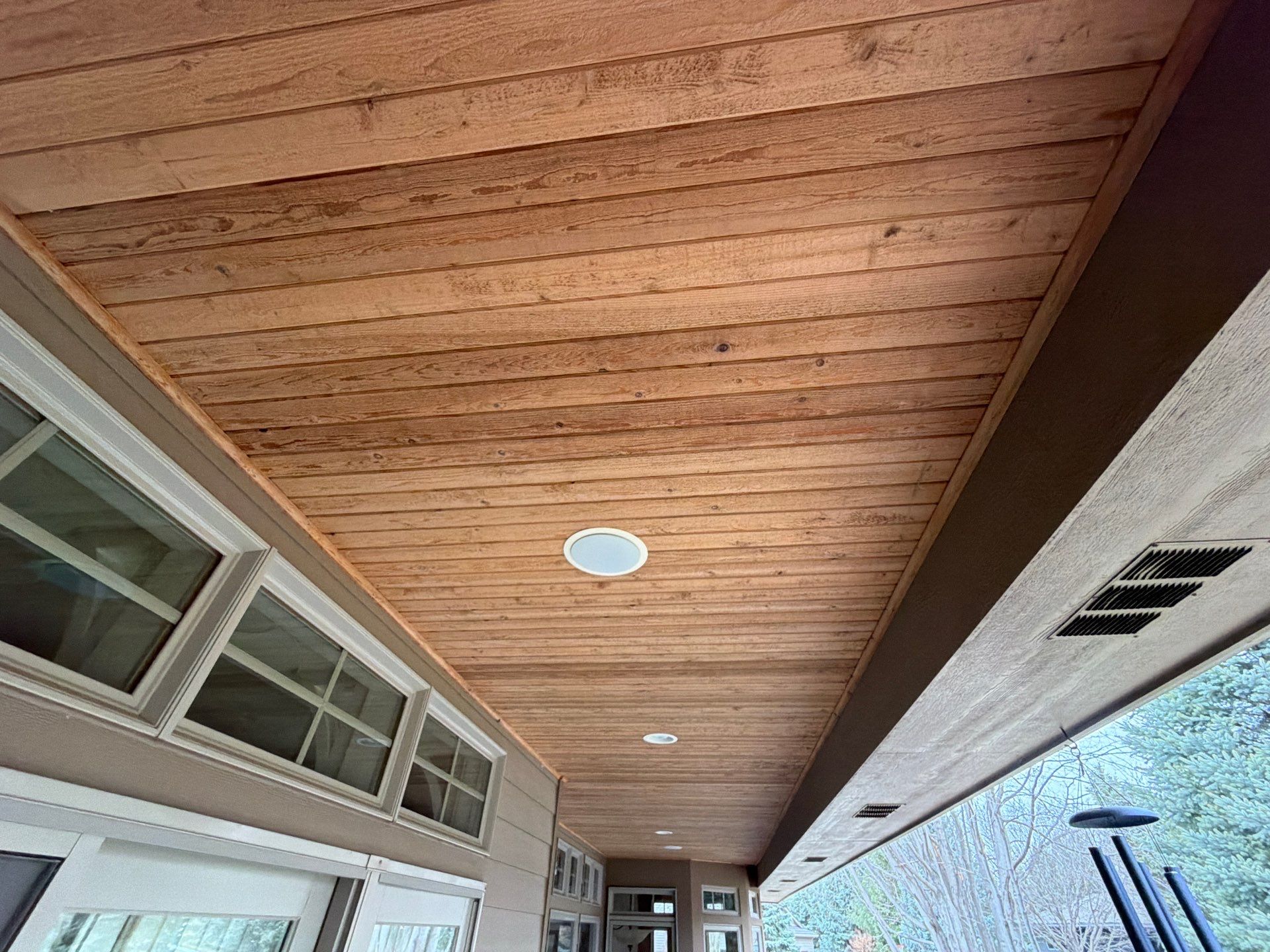 Deck Staining and Tongue and Groove Ceiling Refinish in Sioux Falls by Select Painting, Coatings & Garage Cabinets