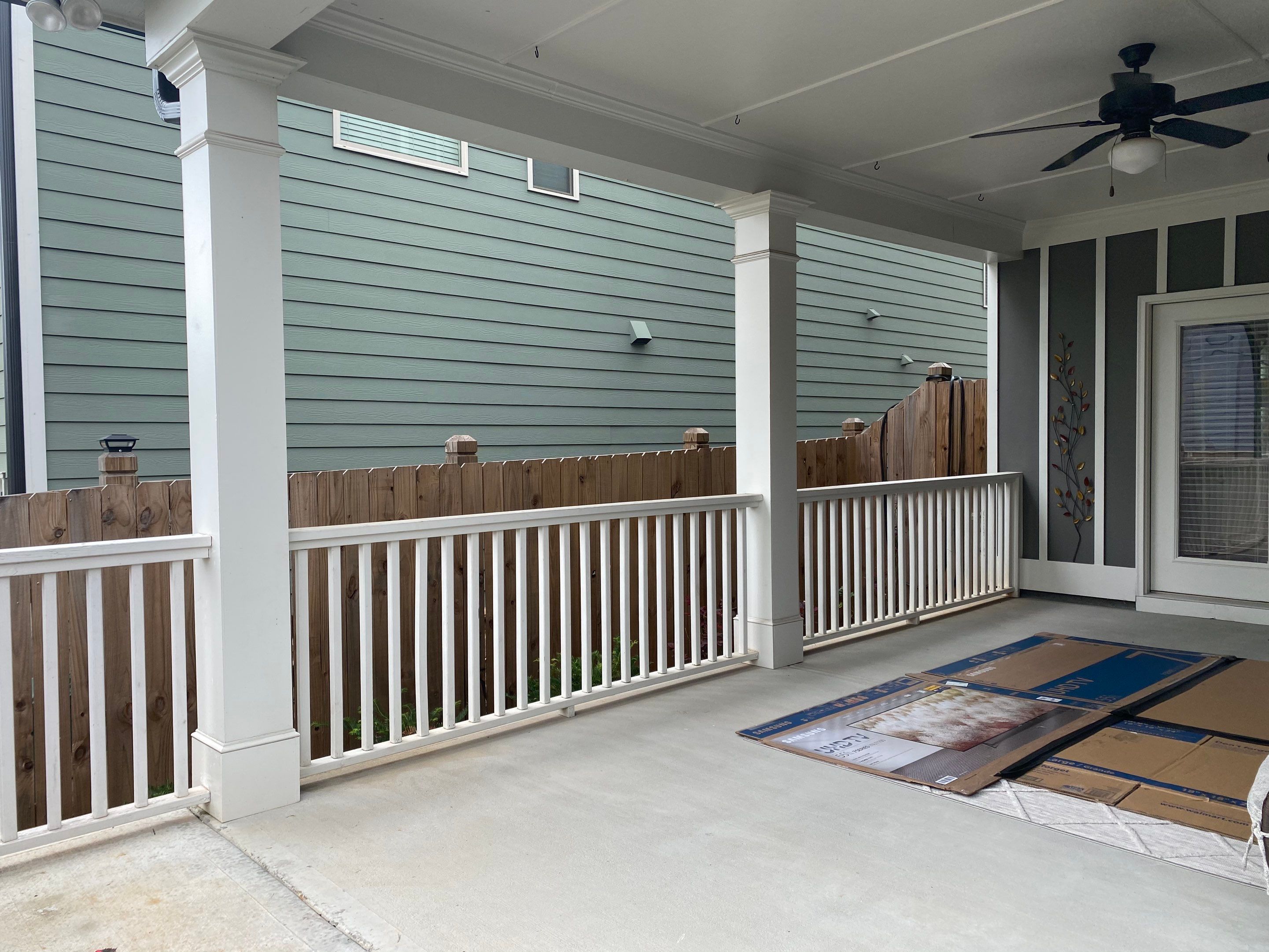 Custom Screened-In Porch Enclosure with White Railings in Smyrna by Swift Home Renovations