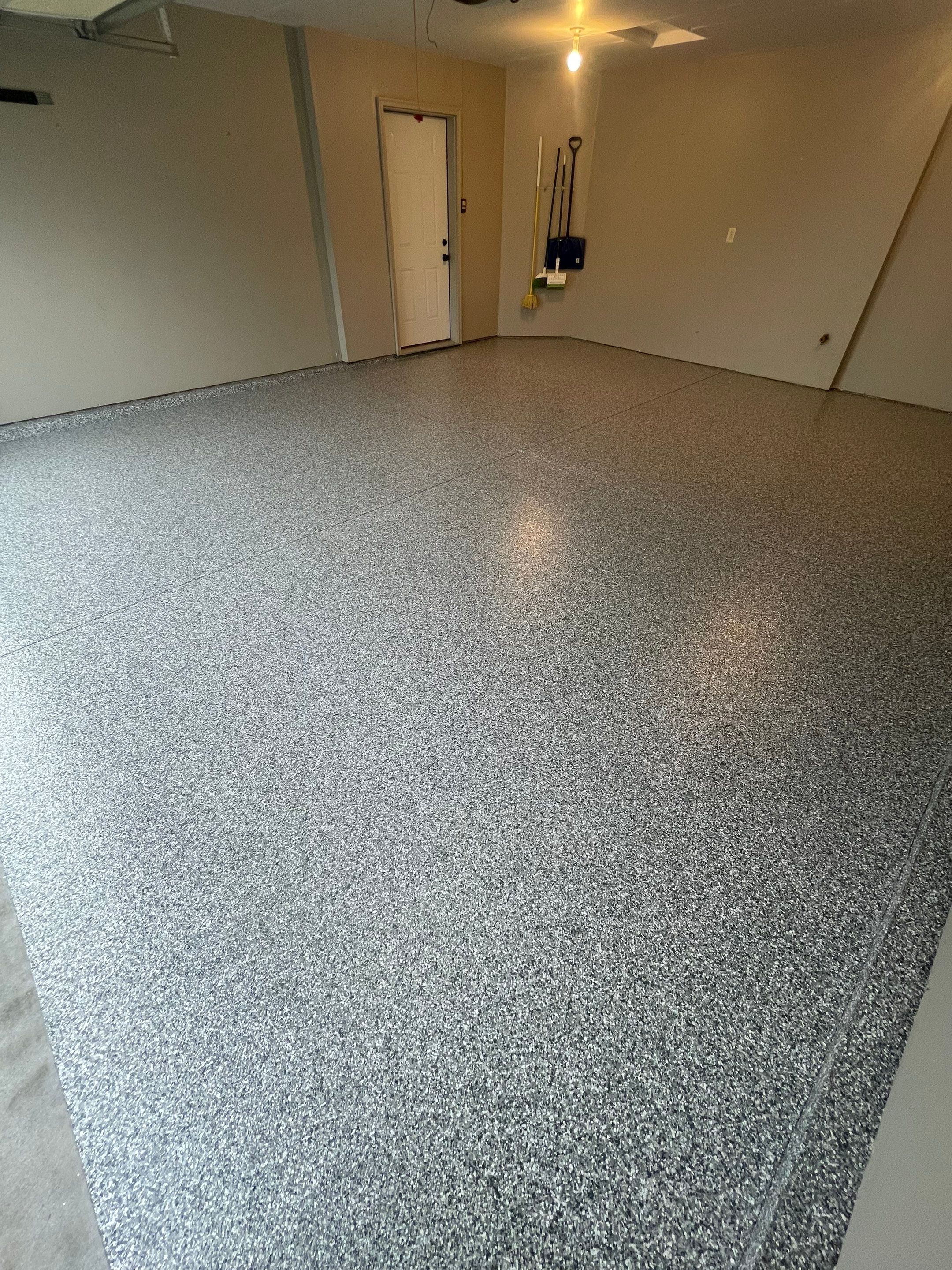 Custom Polyurea Flake Garage Floor Installation in Sioux Falls by Select Painting, Coatings & Garage Cabinets