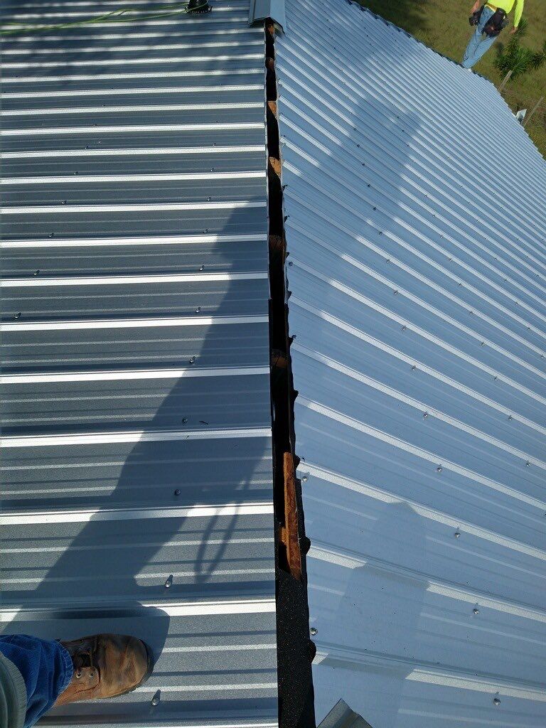 Residential Roofing Installation using 26 GA Rib Panel Galvalume by 1st Class Roofing, Inc.